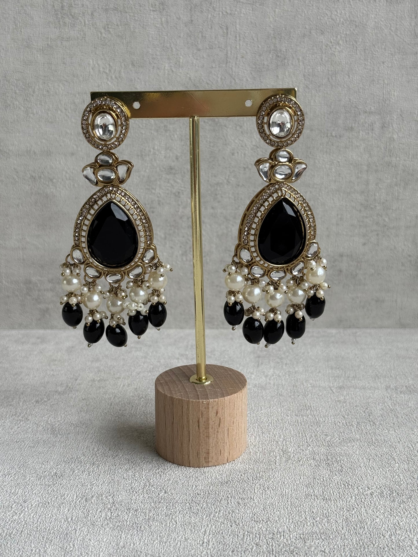 Ayura Designs Nageen Earrings – Antique Gold Jhumkis with Black Stones, Mirror-Cut Accents & Pearl Drops