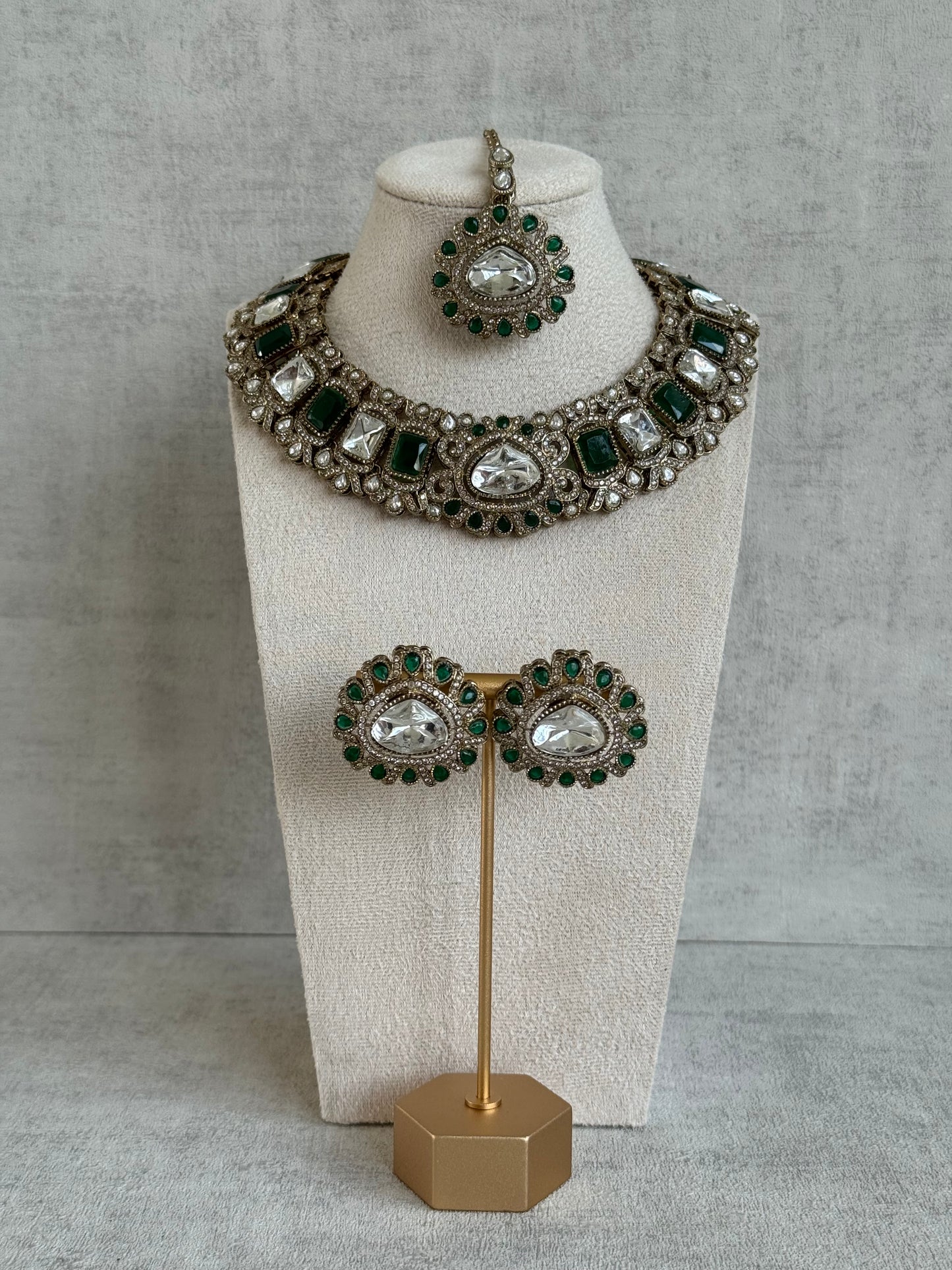 Ayura Designs Riva Set with Studs & Tikka – Emerald Green Mirror-Cut Stones in Antique Gold Finish