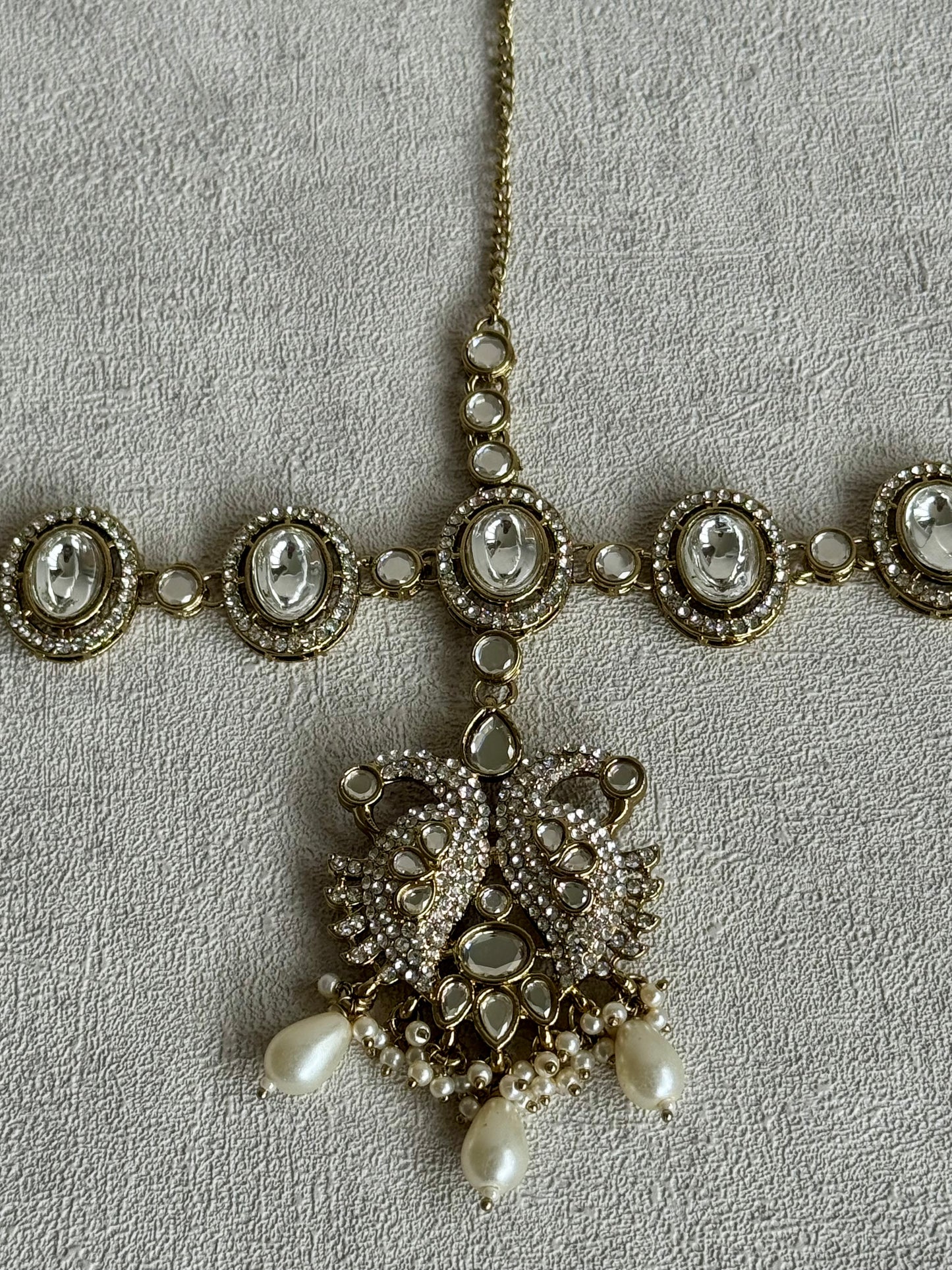 Ayura Designs Tajdar Bridal Set with Necklace, Jhumkis, Tikka, Nath, Ring & Sheeshphool – Jadau Kundan Craftsmanship with Mirror-Cut Polki, Ivory Pearl Drops & Antique Silver-Gold Finish