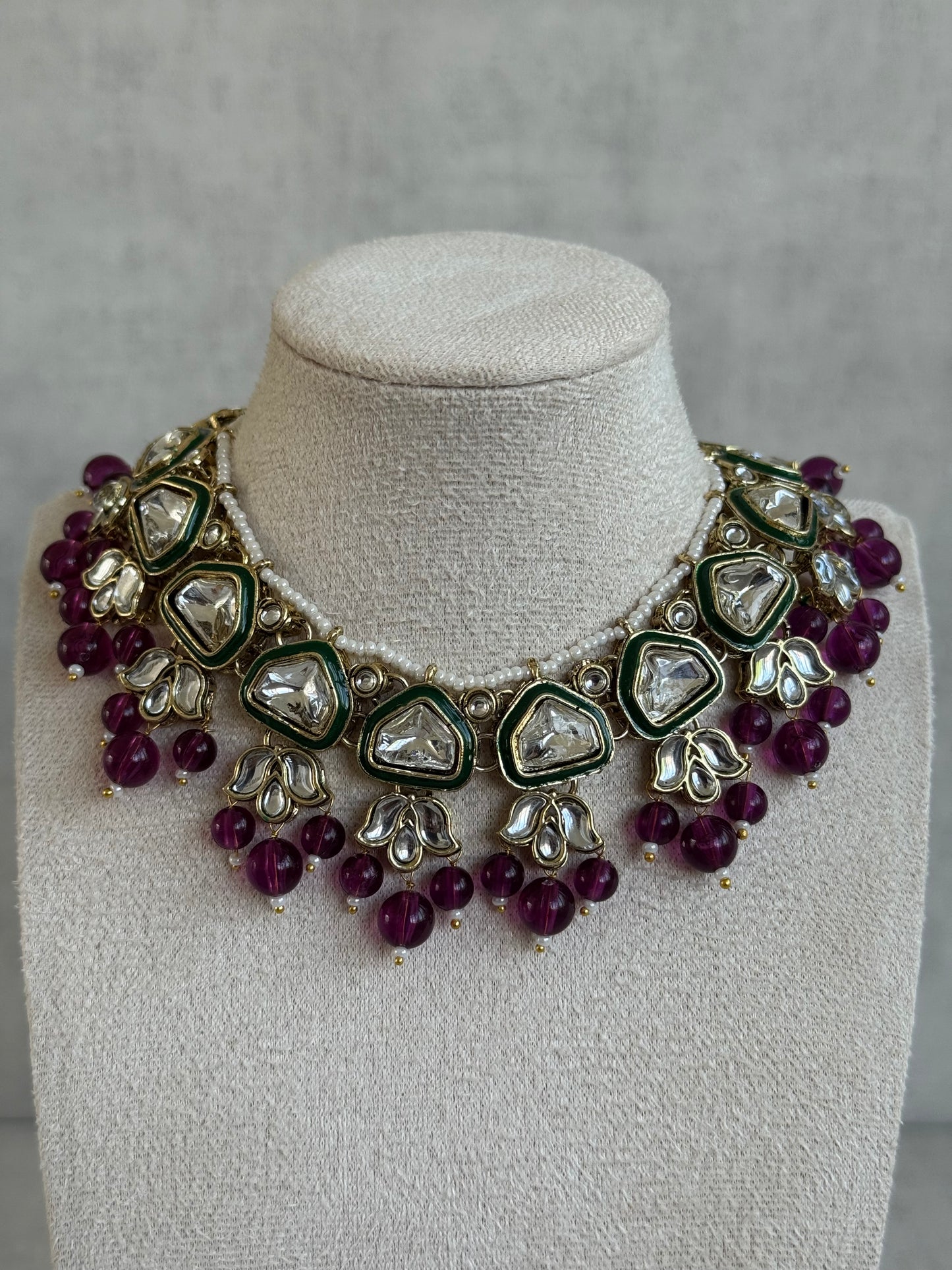 Ayura Designs Izza Set with Jhumkis & Tikka – Mirror-Cut Kundan Stones, Deep Plum Beads & Emerald Green Enamel Finish