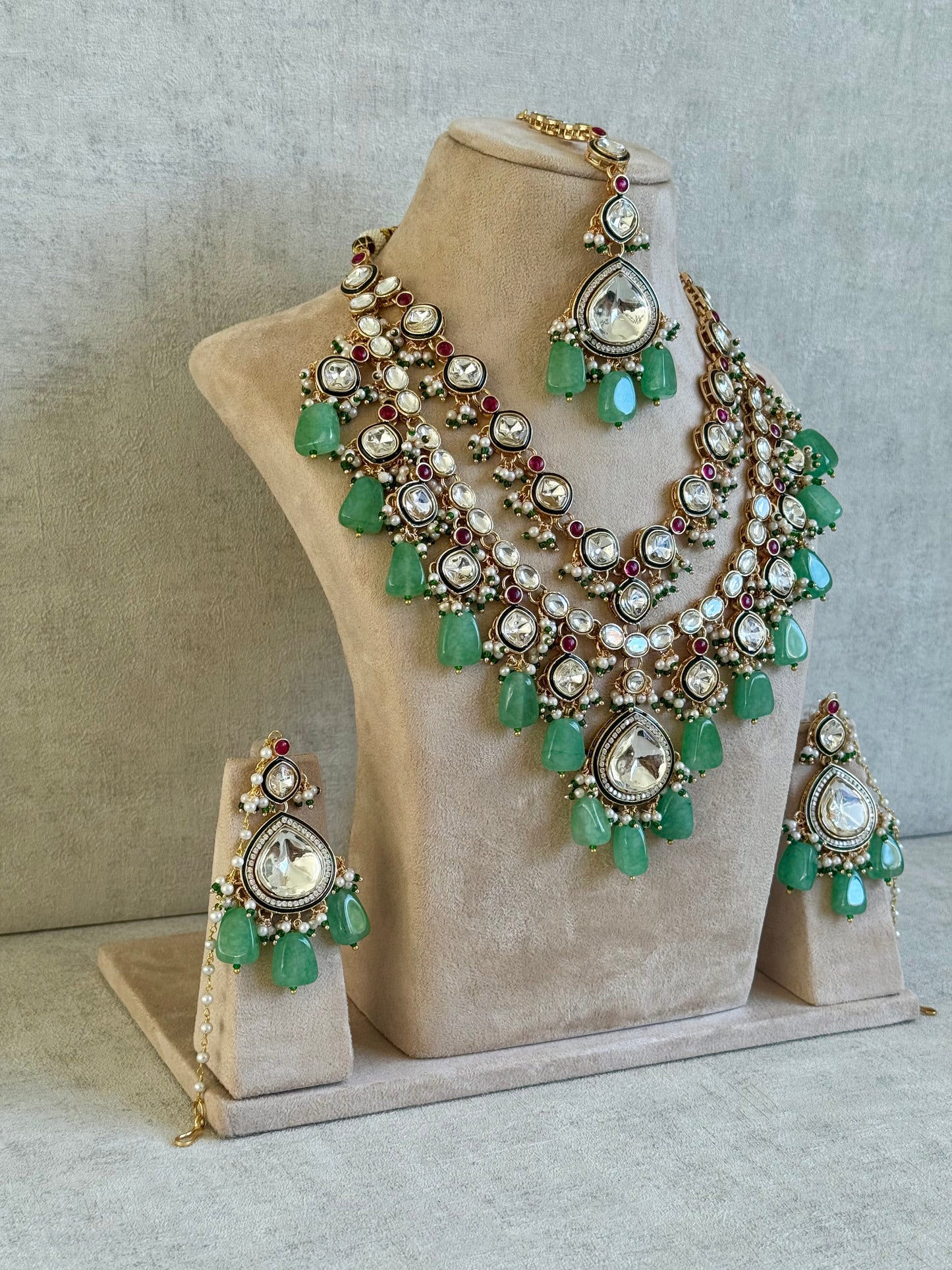 Ayura Designs Malika Bridal Set with Necklace, Jhumkis, Tikka, Nath, Ring & Sheeshphool – Jadau Kundan Craftsmanship with Mirror-Cut Polki, Jade-Toned Drops, Ruby Accents & Antique Gold Finish