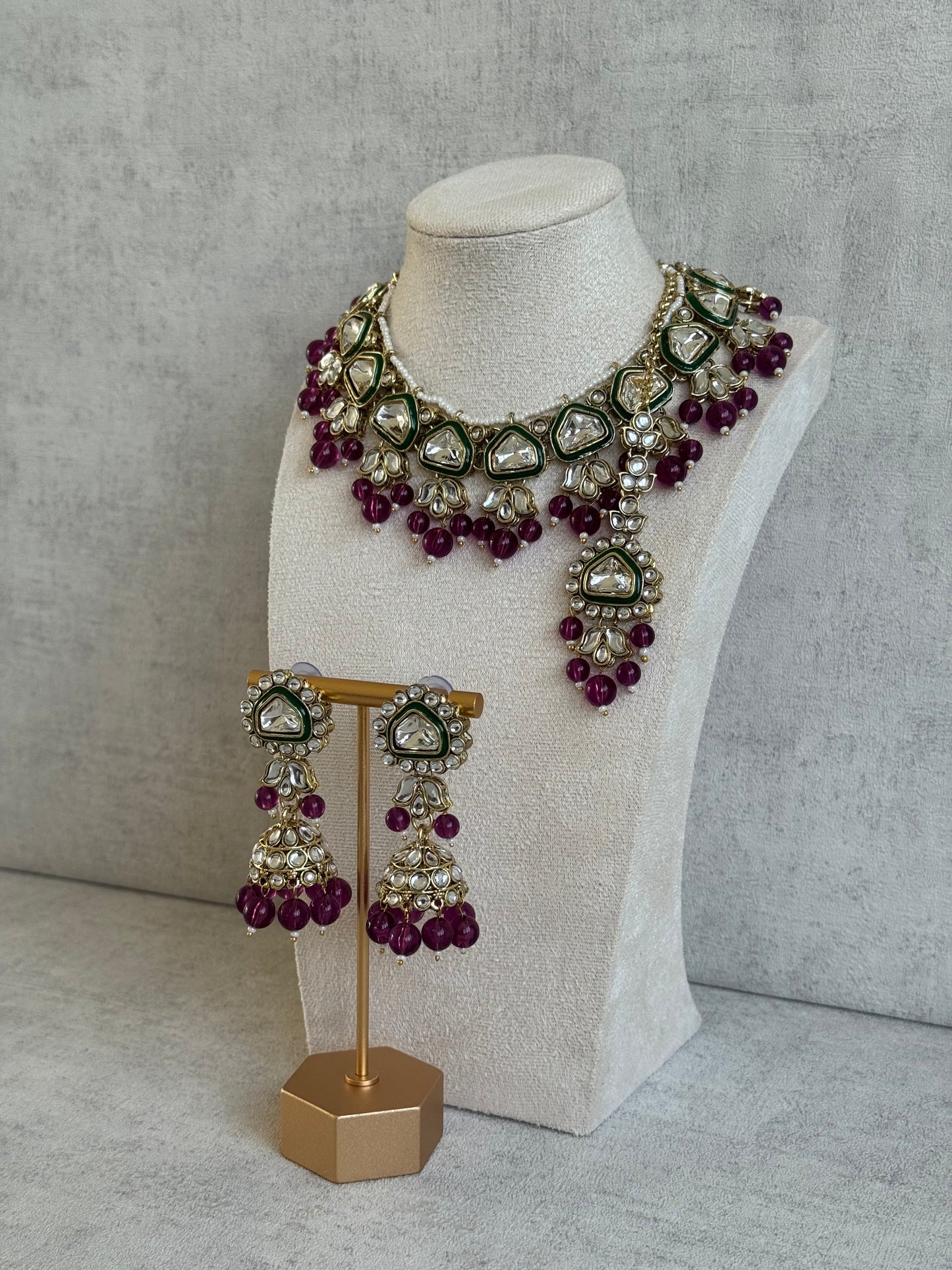 Ayura Designs Izza Set with Jhumkis & Tikka – Mirror-Cut Kundan Stones, Deep Plum Beads & Emerald Green Enamel Finish