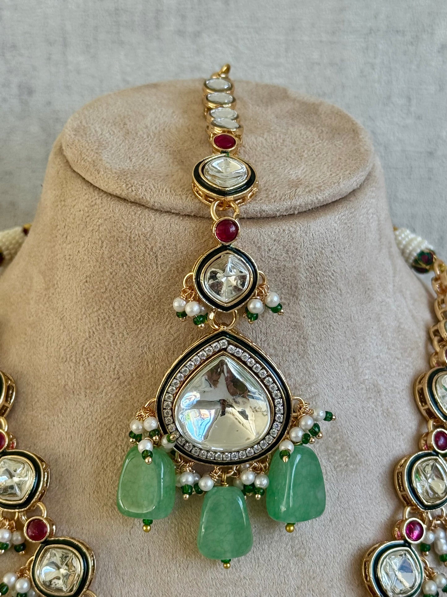 Ayura Designs Malika Bridal Set with Necklace, Jhumkis, Tikka, Nath, Ring & Sheeshphool – Jadau Kundan Craftsmanship with Mirror-Cut Polki, Jade-Toned Drops, Ruby Accents & Antique Gold Finish