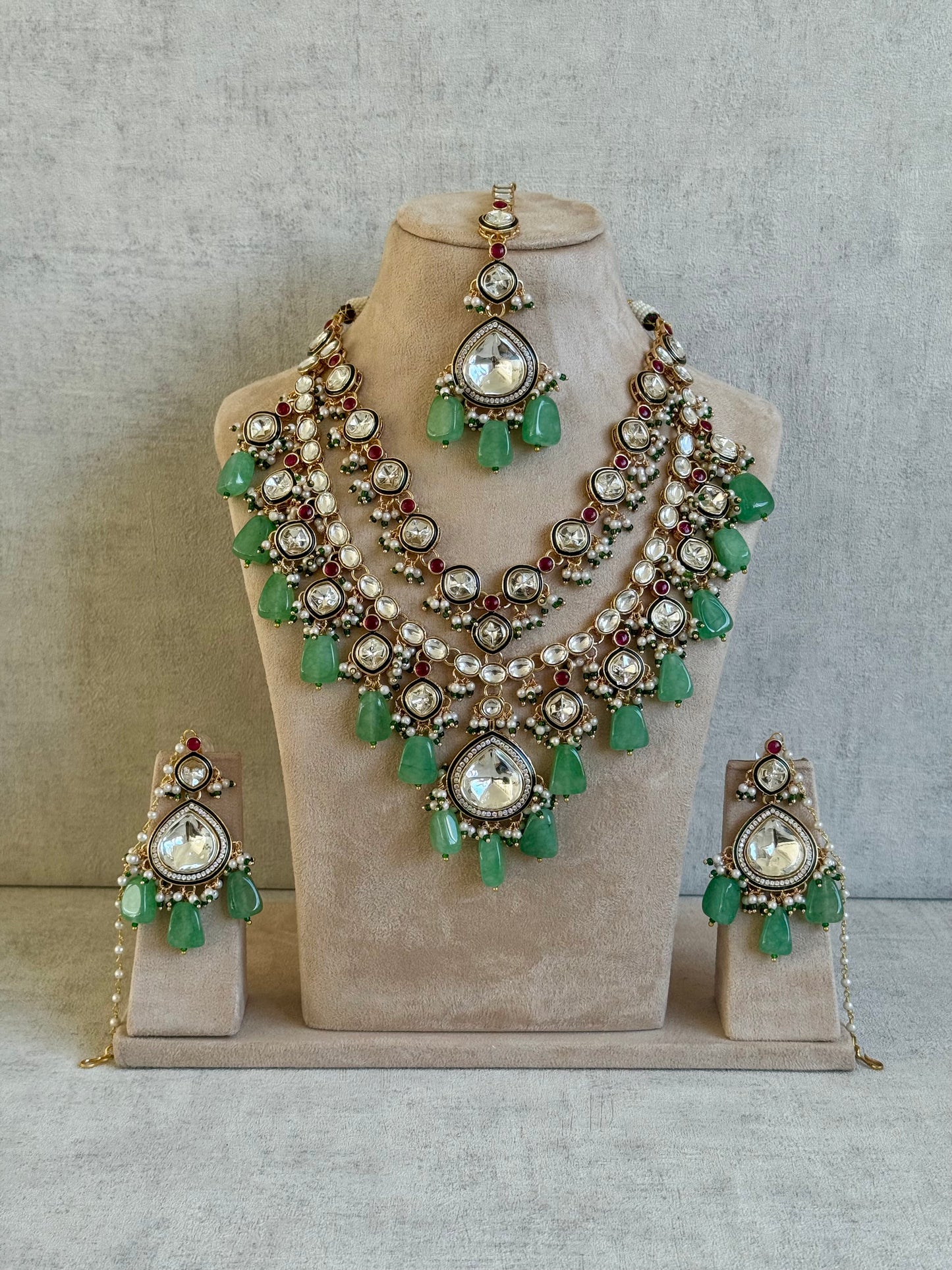 Ayura Designs Malika Bridal Set with Necklace, Jhumkis, Tikka, Nath, Ring & Sheeshphool – Jadau Kundan Craftsmanship with Mirror-Cut Polki, Jade-Toned Drops, Ruby Accents & Antique Gold Finish