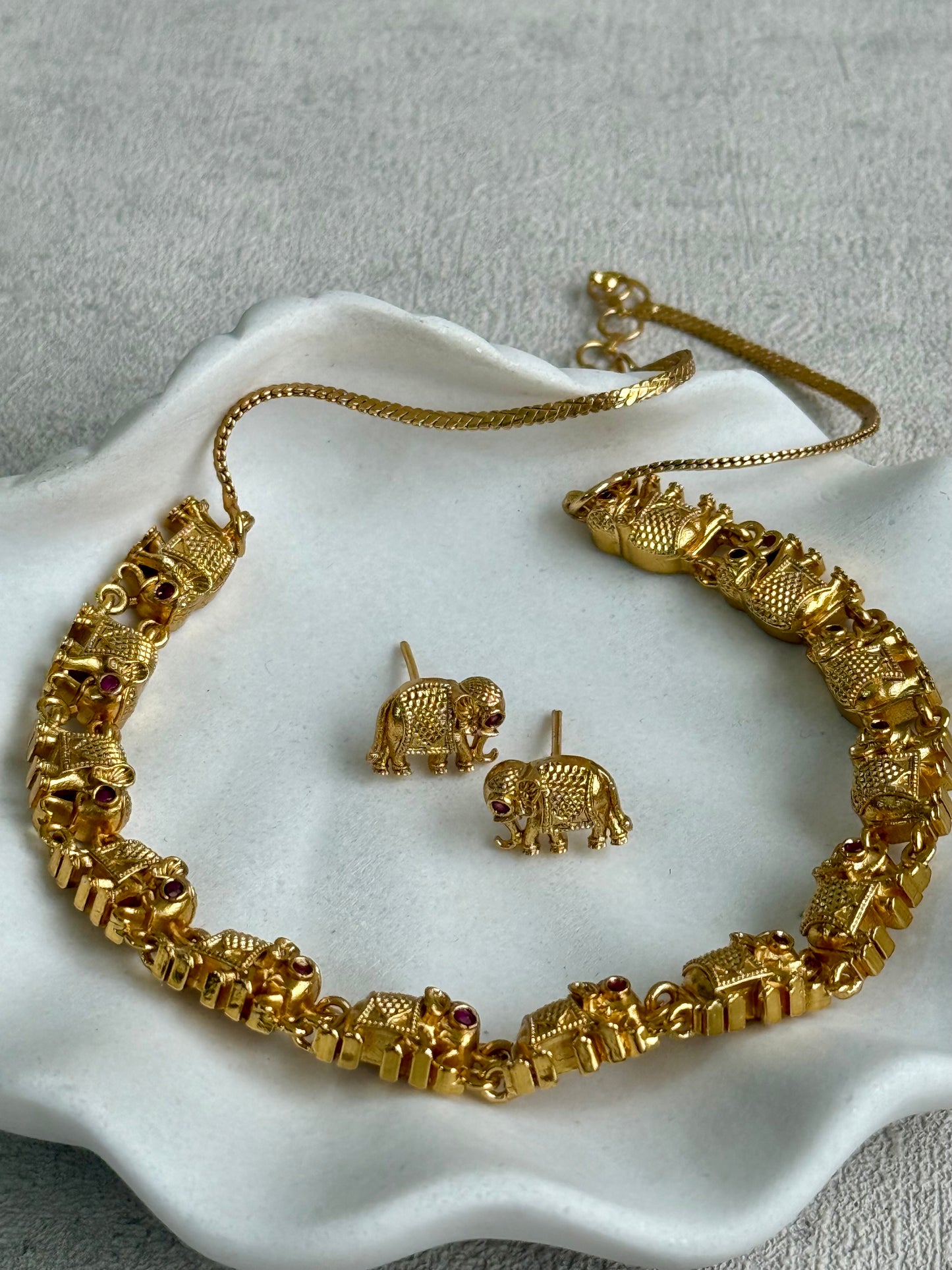 Ayura Designs Veda Set – Antique Gold Necklace & Stud Earrings with Elephant Motifs and Pink Stone Detailing
