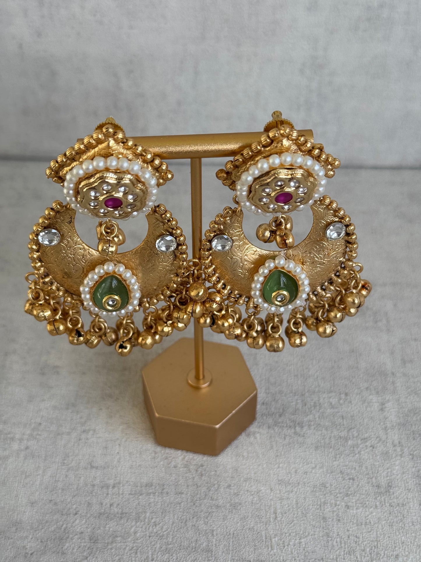 Ayura Designs Naaz Earrings – Antique Gold Jhumkas with Green Teardrop Stone, Pearl Embellishments & Ghungroo Detailing