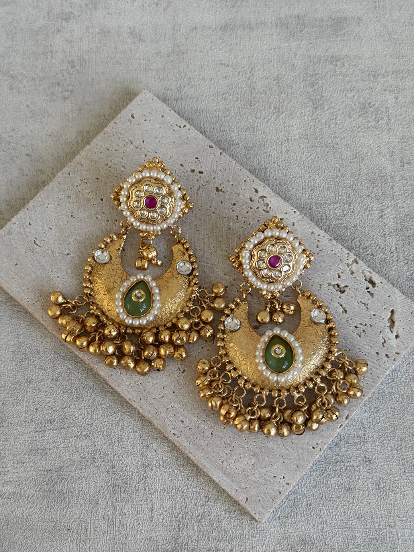 Ayura Designs Naaz Earrings – Antique Gold Jhumkas with Green Teardrop Stone, Pearl Embellishments & Ghungroo Detailing