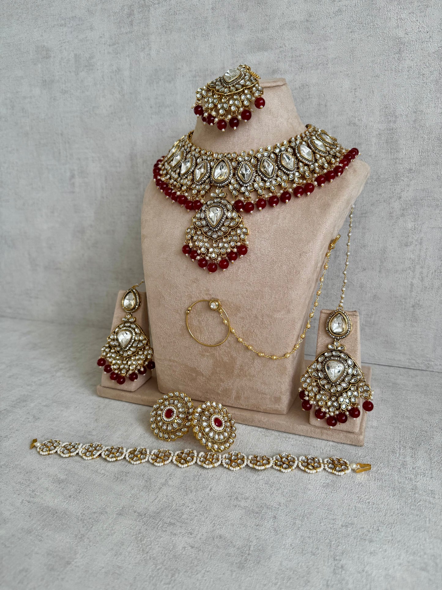Ayura Designs Gulbahar Bridal Set with Necklace, Jhumkis, Tikka, Nath, Ring & Sheeshphool – Jadau Kundan Craftsmanship with Mirror-Cut Polki, Red Beads & Antique Gold Finish