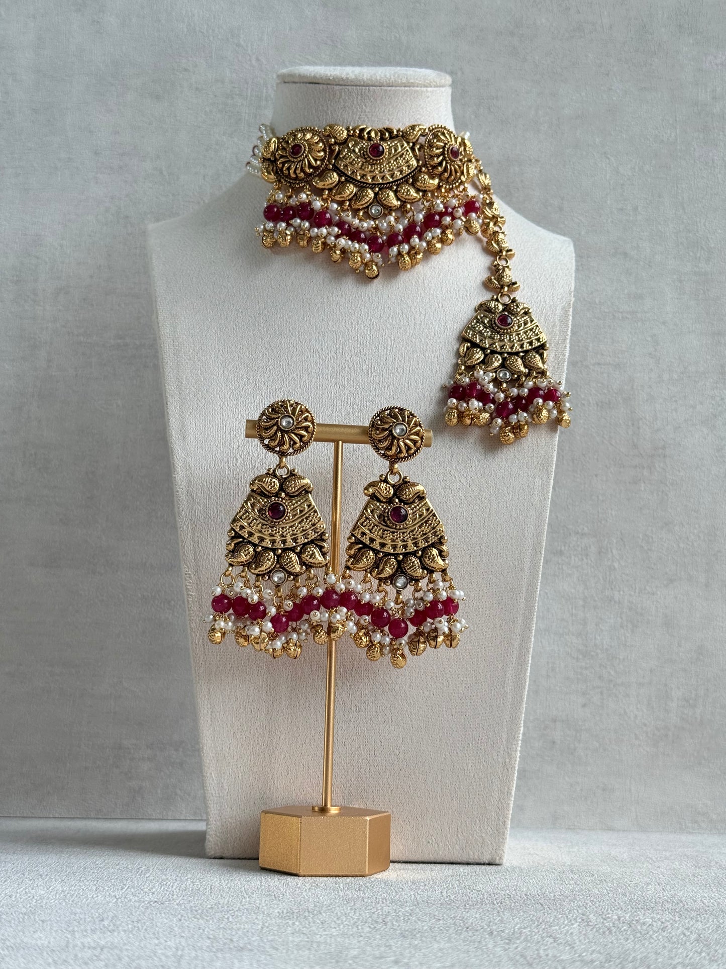 Ayura Designs Sairish Choker Set with Earrings & Tikka – Ruby Pink Beads, Pearl Detailing, Ghungroos, Paisley Motifs & Antique Gold Finish