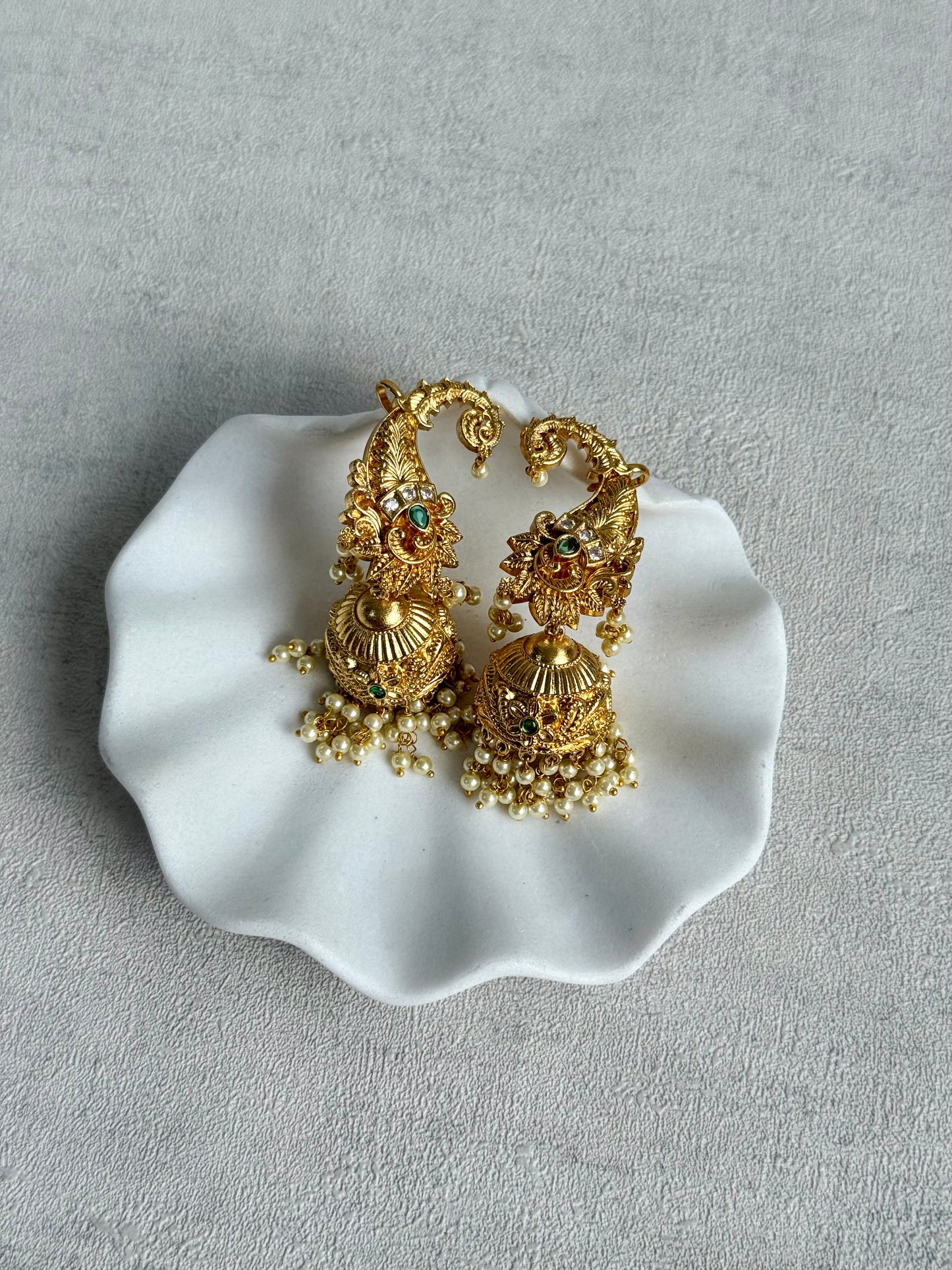 Ayura Designs Anika Jhumkis – Gold Half Ear Cuffs with Peacock Motif, Green Stone Accents, Kundan Crystals & Pearl Jhumka Drops
