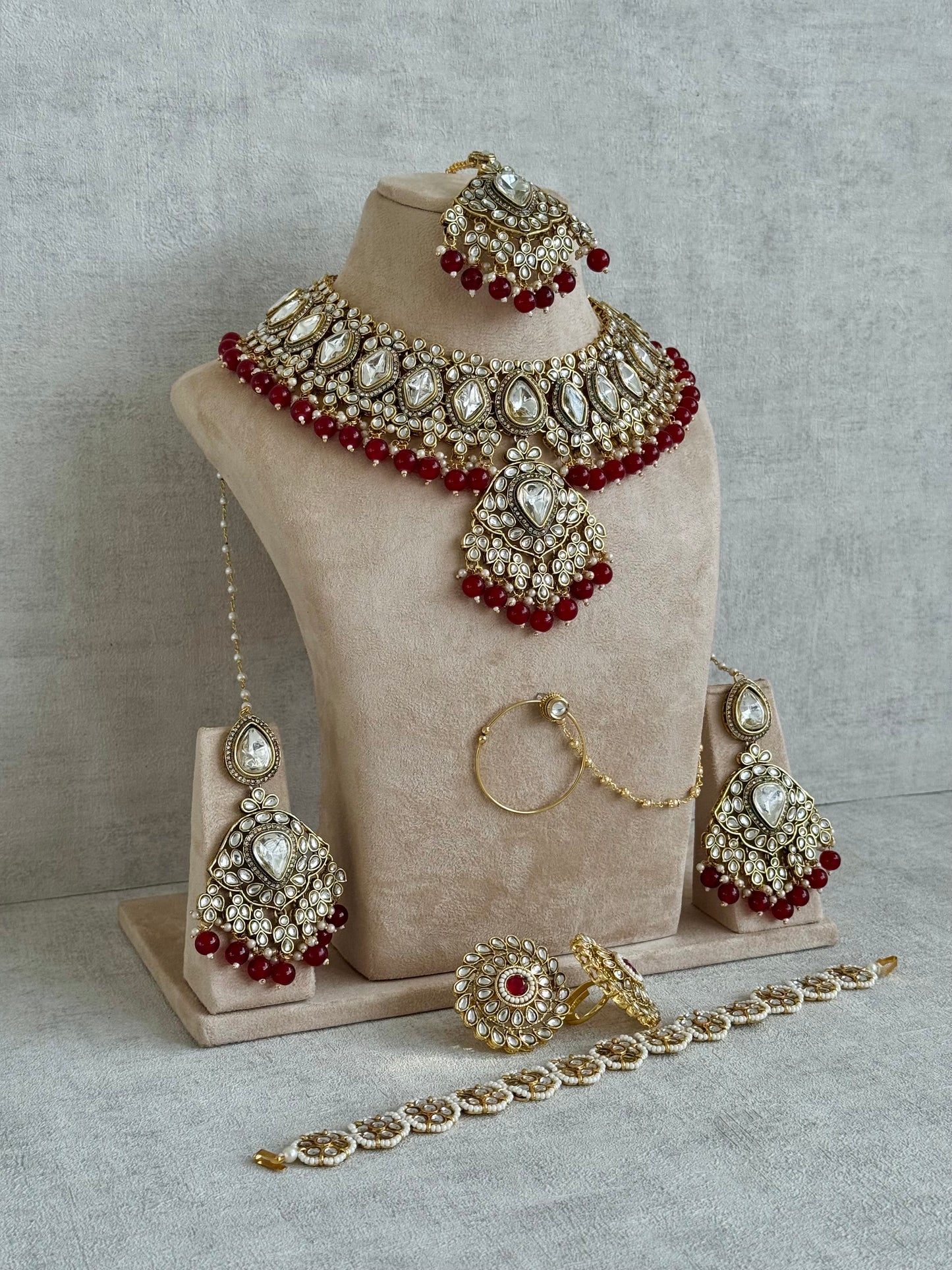 Ayura Designs Gulbahar Bridal Set with Necklace, Jhumkis, Tikka, Nath, Ring & Sheeshphool – Jadau Kundan Craftsmanship with Mirror-Cut Polki, Red Beads & Antique Gold Finish