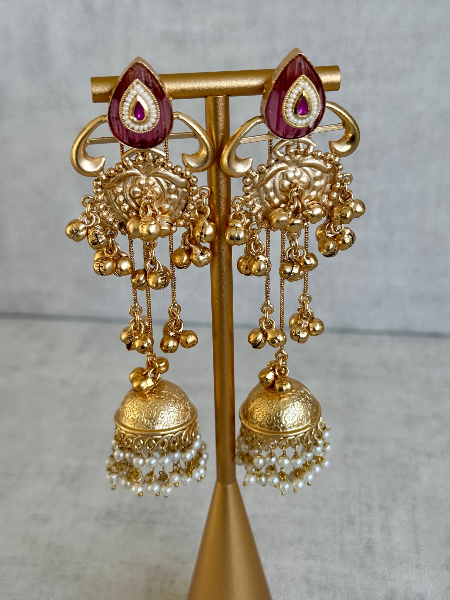 Ayura Designs Prisha Earrings – Antique Gold Jhumkas with Ruby Red Studs, Pearl Detailing & Long Dangling Chains