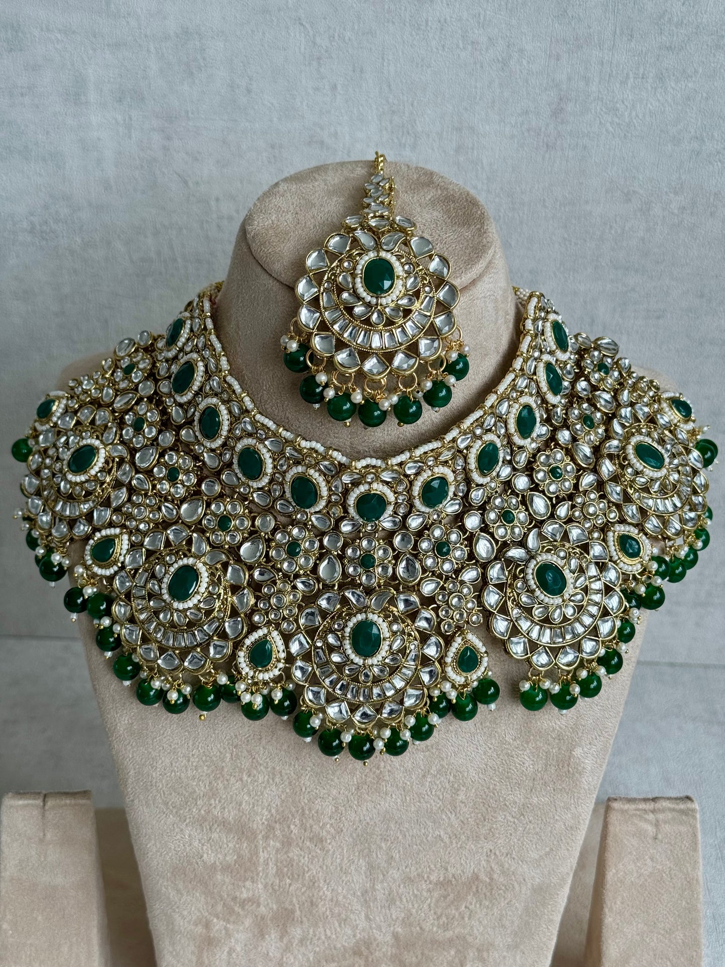 Ayura Designs Meherbano Bridal Set with Necklace, Jhumkis, Tikka, Nath, Ring & Sheeshphool – Jadau Kundan Craftsmanship with Mirror-Cut Polki, Emerald Green Stones & Antique Gold Finish