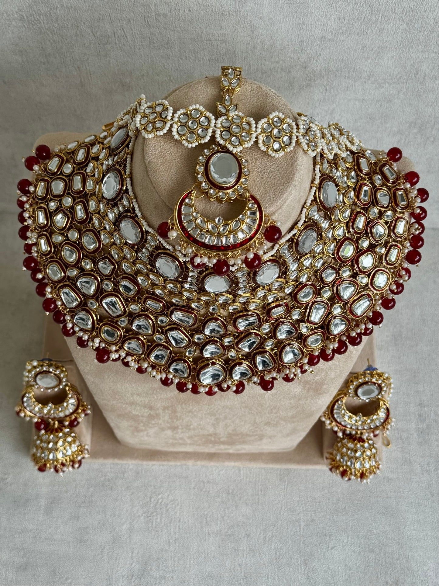 Ayura Designs Gulbadan Bridal Set with Necklace, Jhumkis, Tikka, Nath, Ring & Sheeshphool – Jadau Kundan Craftsmanship with Mirror-Cut Polki, Ruby Red Stones & Antique Gold Finish