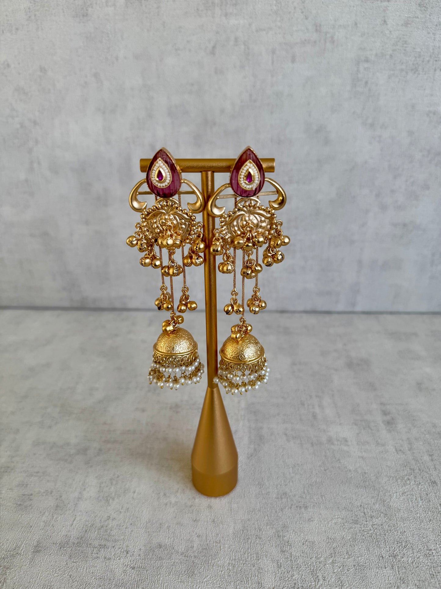 Ayura Designs Prisha Earrings – Antique Gold Jhumkas with Ruby Red Studs, Pearl Detailing & Long Dangling Chains