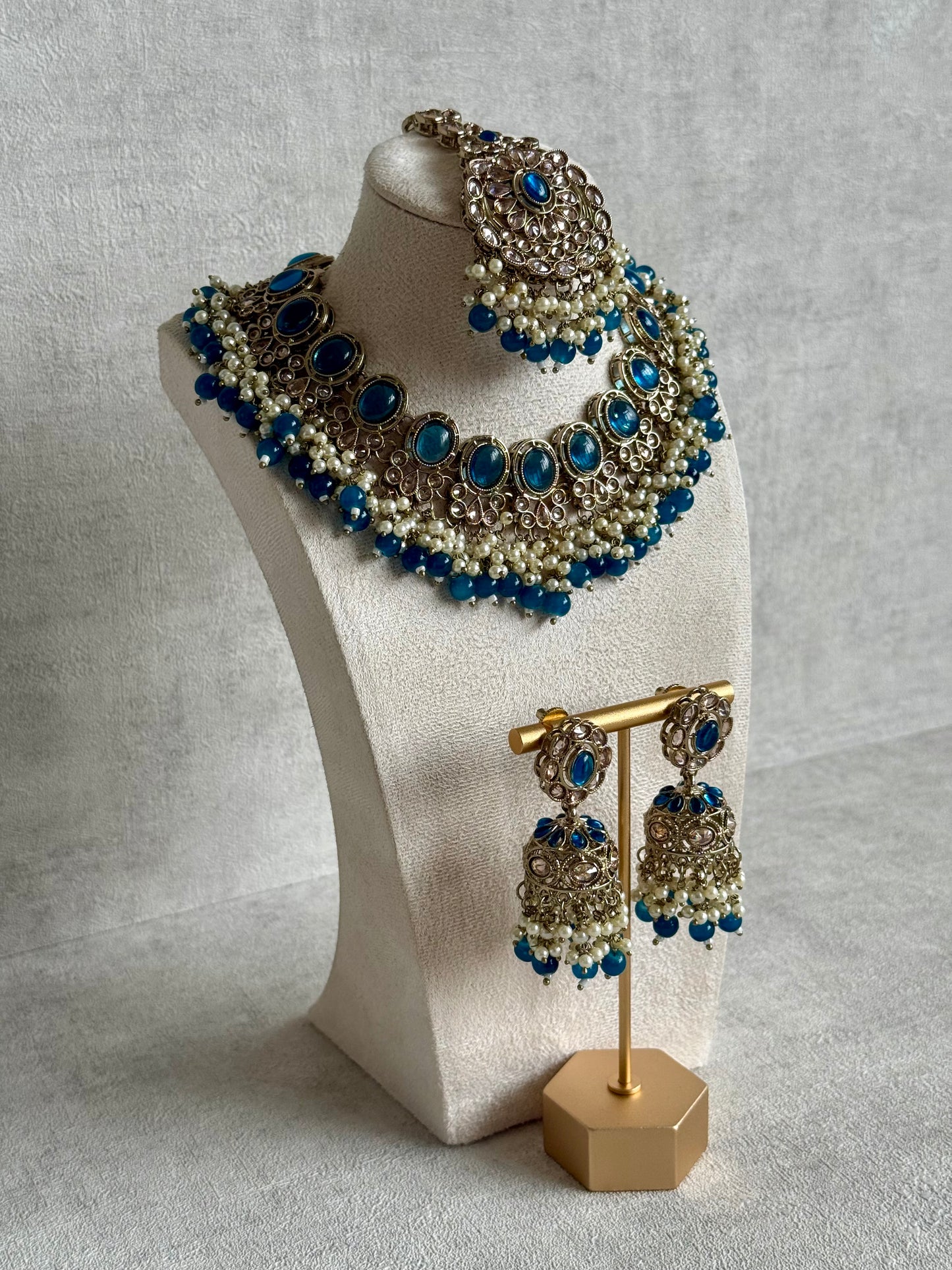 Ayura Designs Zubi Set with Jhumkis & Tikka – Deep Blue Stones, Pearl Detailing & Antique Gold Finish