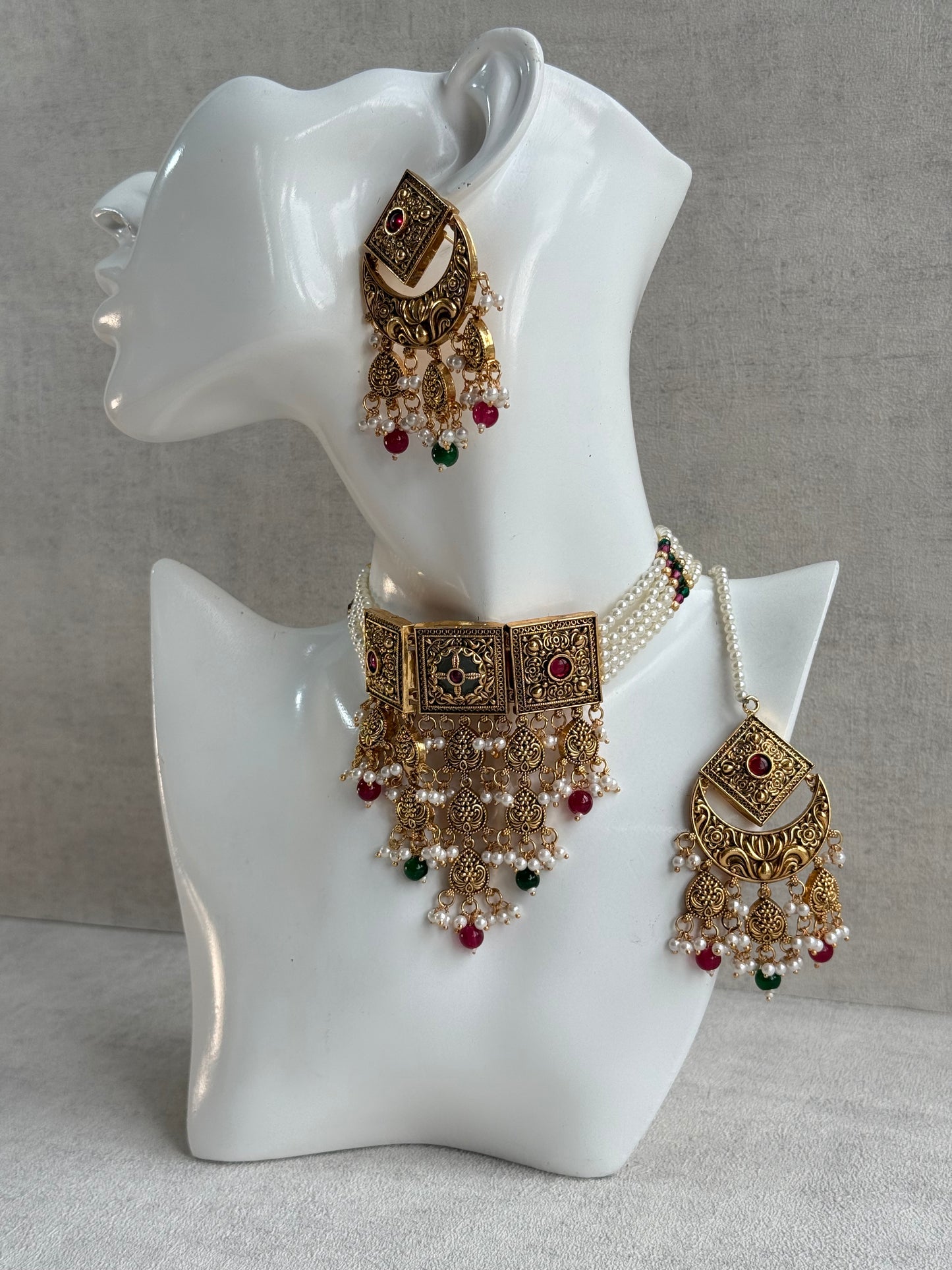 Ayura Designs Samera Choker Set with Earrings & Tikka – Rani Pink & Emerald Green Beads, Pearl Detailing, Green Centre Stone, Floral Motifs & Antique Gold Finish