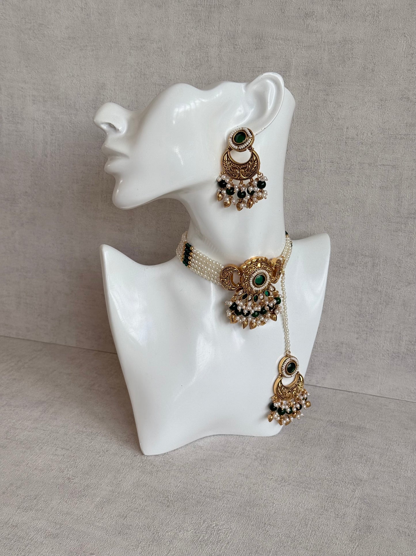 Ayura Designs Mehr Choker Set with Earrings & Tikka – Emerald Green Stones, Pearl Beads, Pearl Strands & Antique Gold Finish