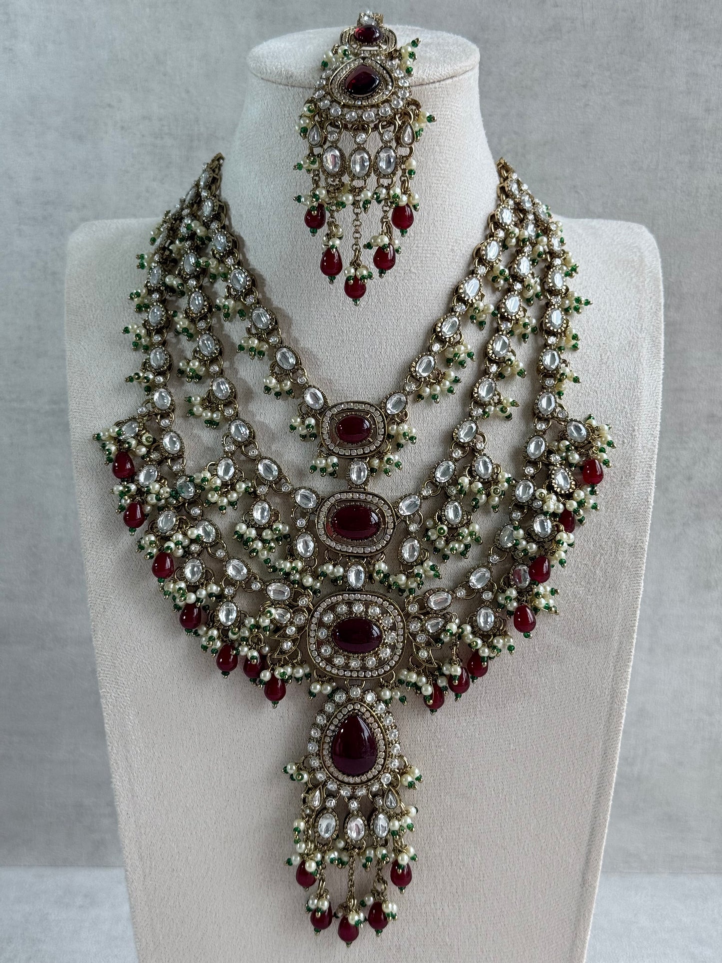 Ayura Designs Sahra Bridal Set with Earrings & Tikka – Ruby Red, Kundan Stones, Pearls & Emerald Green Accents in Antique Gold Finish