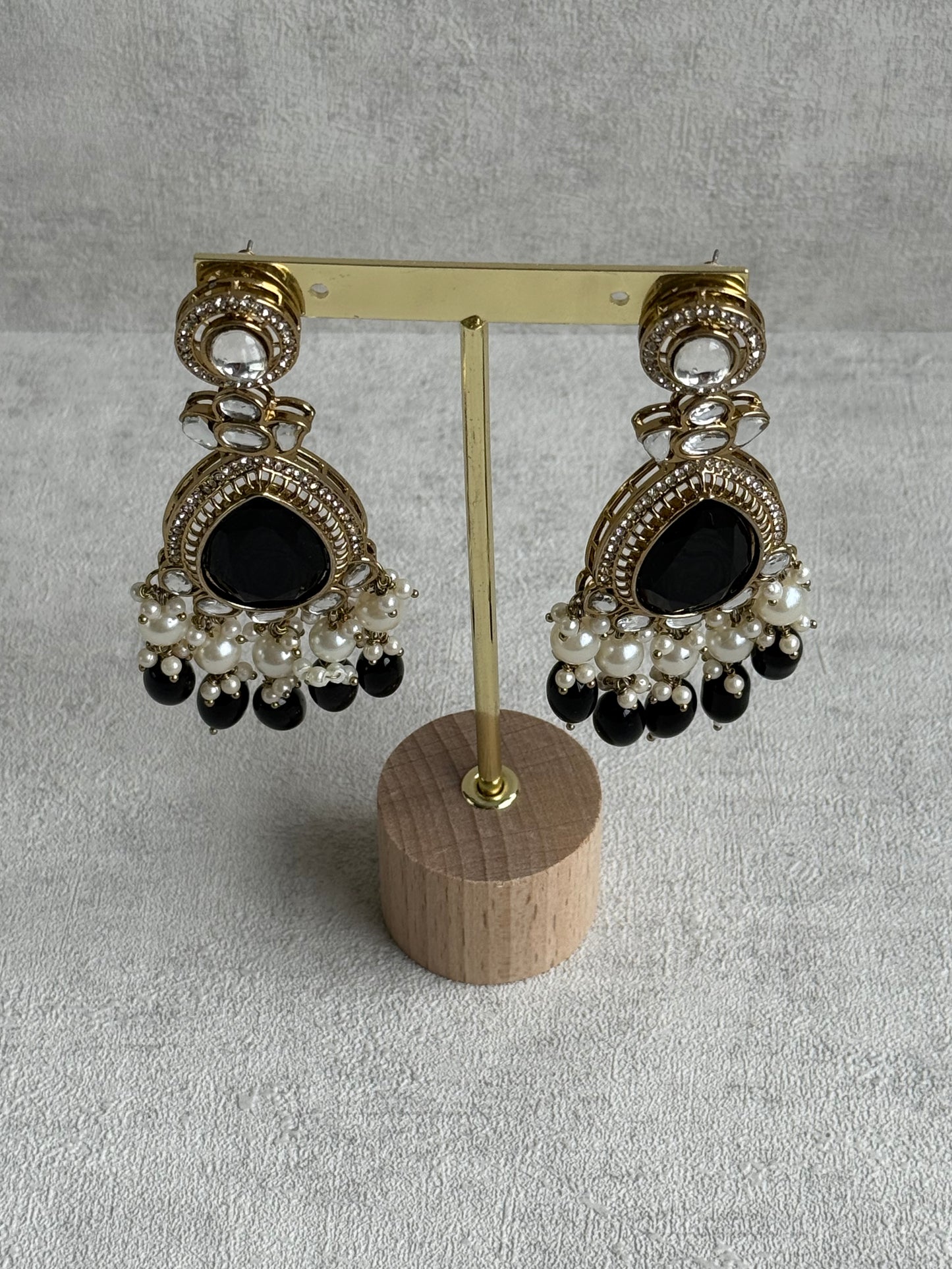 Ayura Designs Nageen Earrings – Antique Gold Jhumkis with Black Stones, Mirror-Cut Accents & Pearl Drops