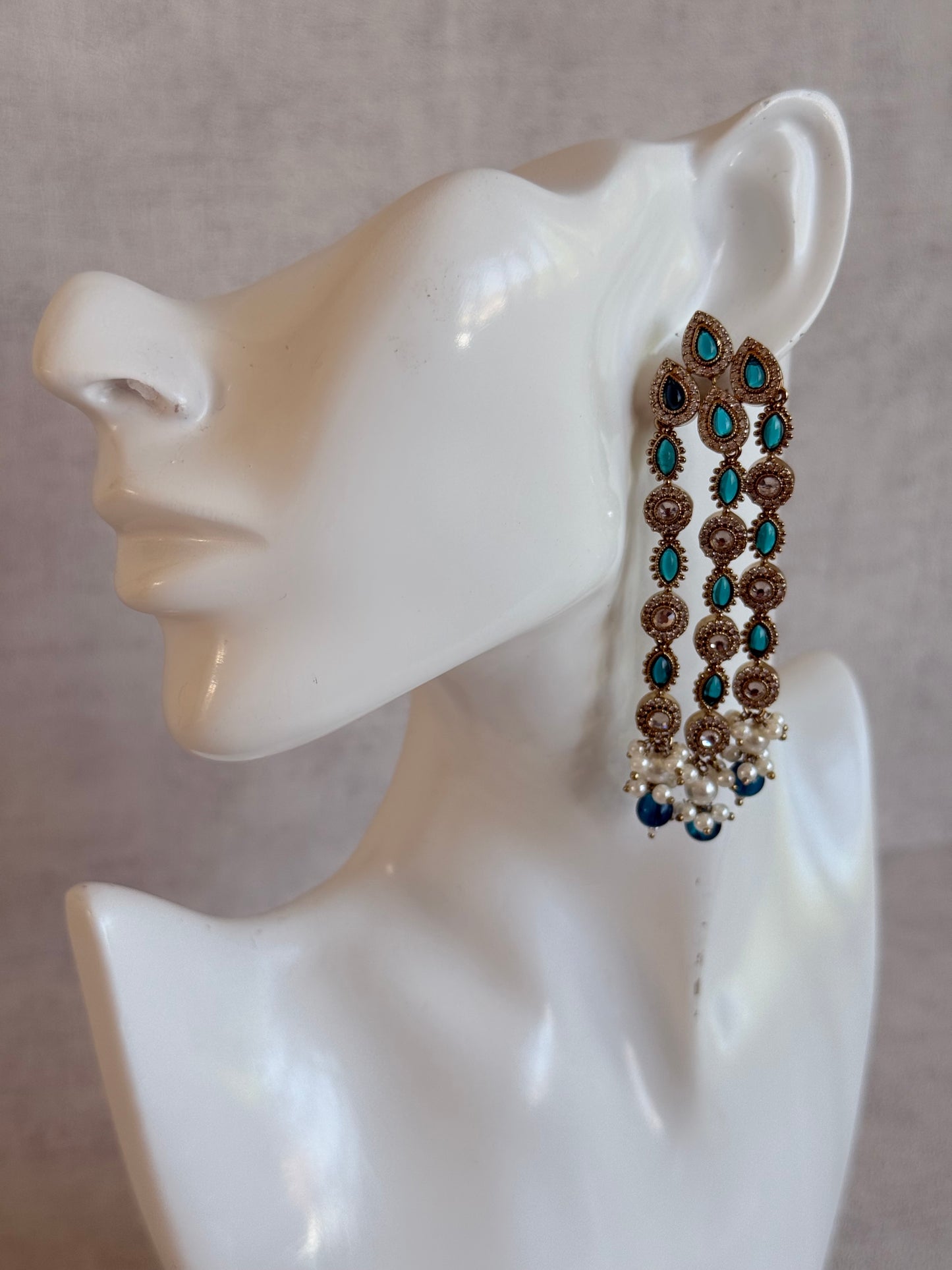 Ayura Designs Emilia Earrings – Gold Triple Strand Statement Earrings with Peacock Blue Stones & Pearl Drops