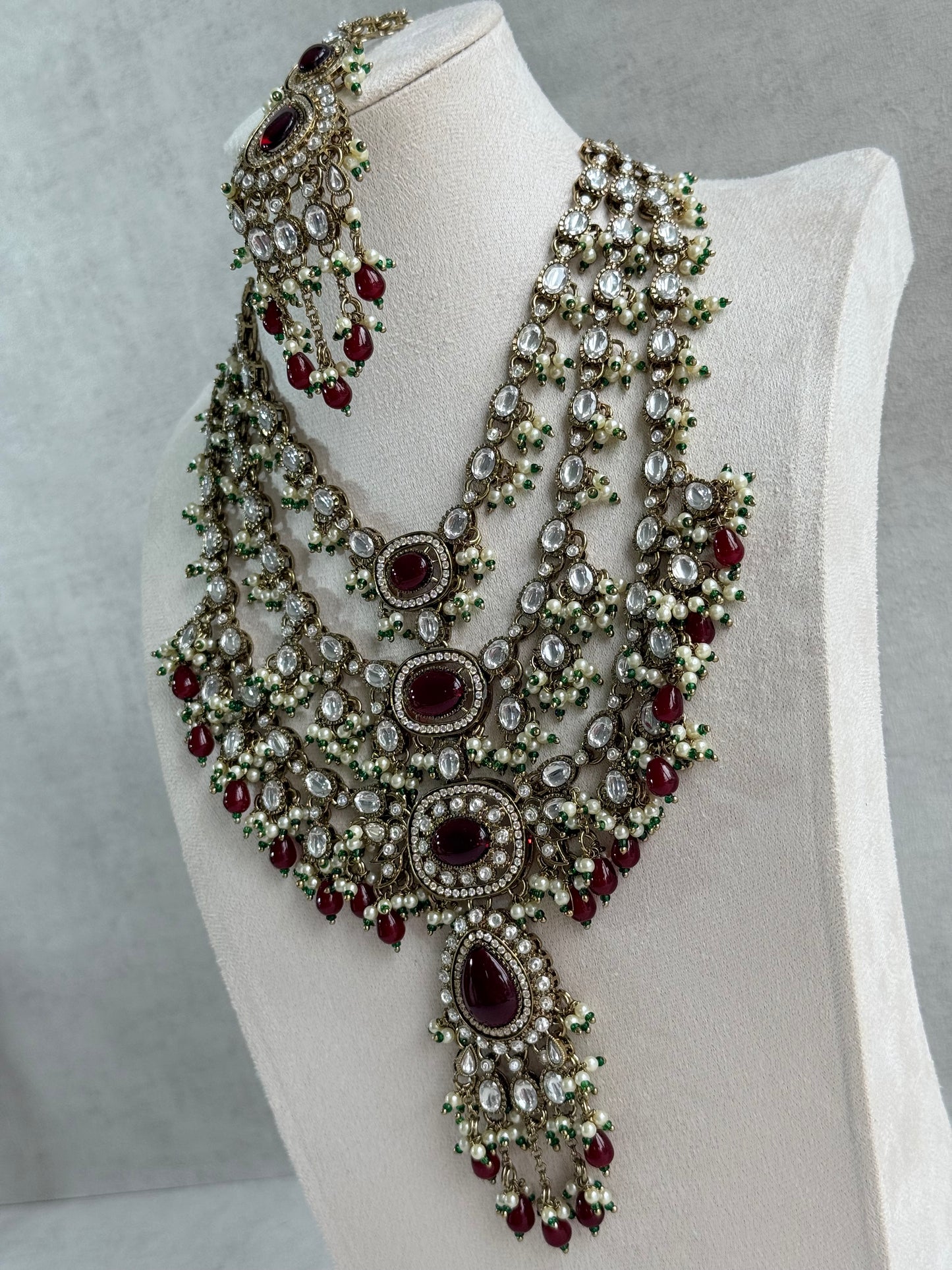 Ayura Designs Sahra Bridal Set with Earrings & Tikka – Ruby Red, Kundan Stones, Pearls & Emerald Green Accents in Antique Gold Finish