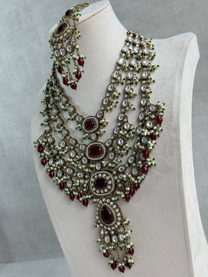 Ayura Designs Sahra Bridal Set with Earrings & Tikka – Ruby Red, Kundan Stones, Pearls & Emerald Green Accents in Antique Gold Finish