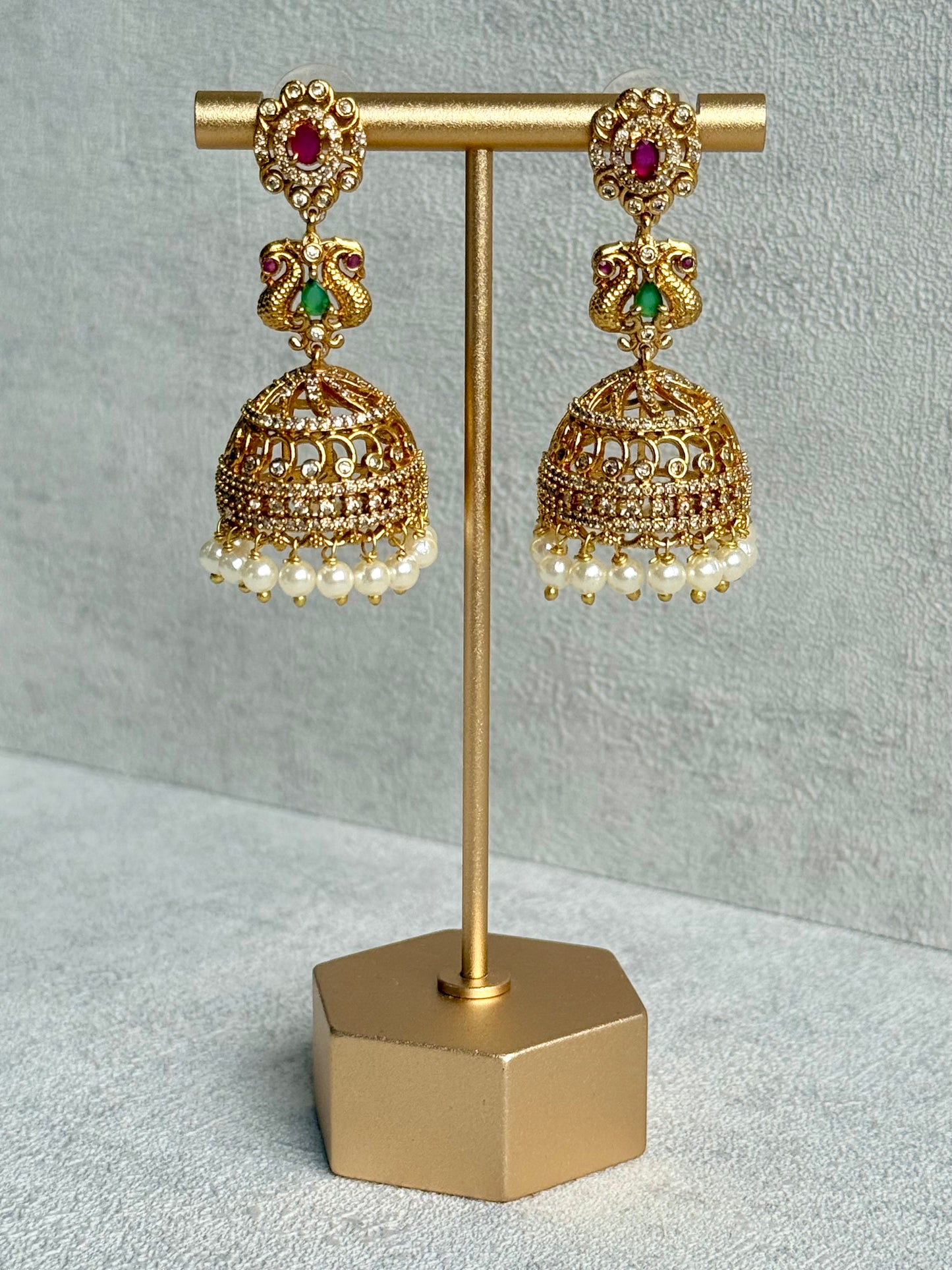 Ayura Designs Darya Jhumkis – Gold Peacock Motif Jhumkis with Ruby Pink, Emerald Green and Pearl Detailing