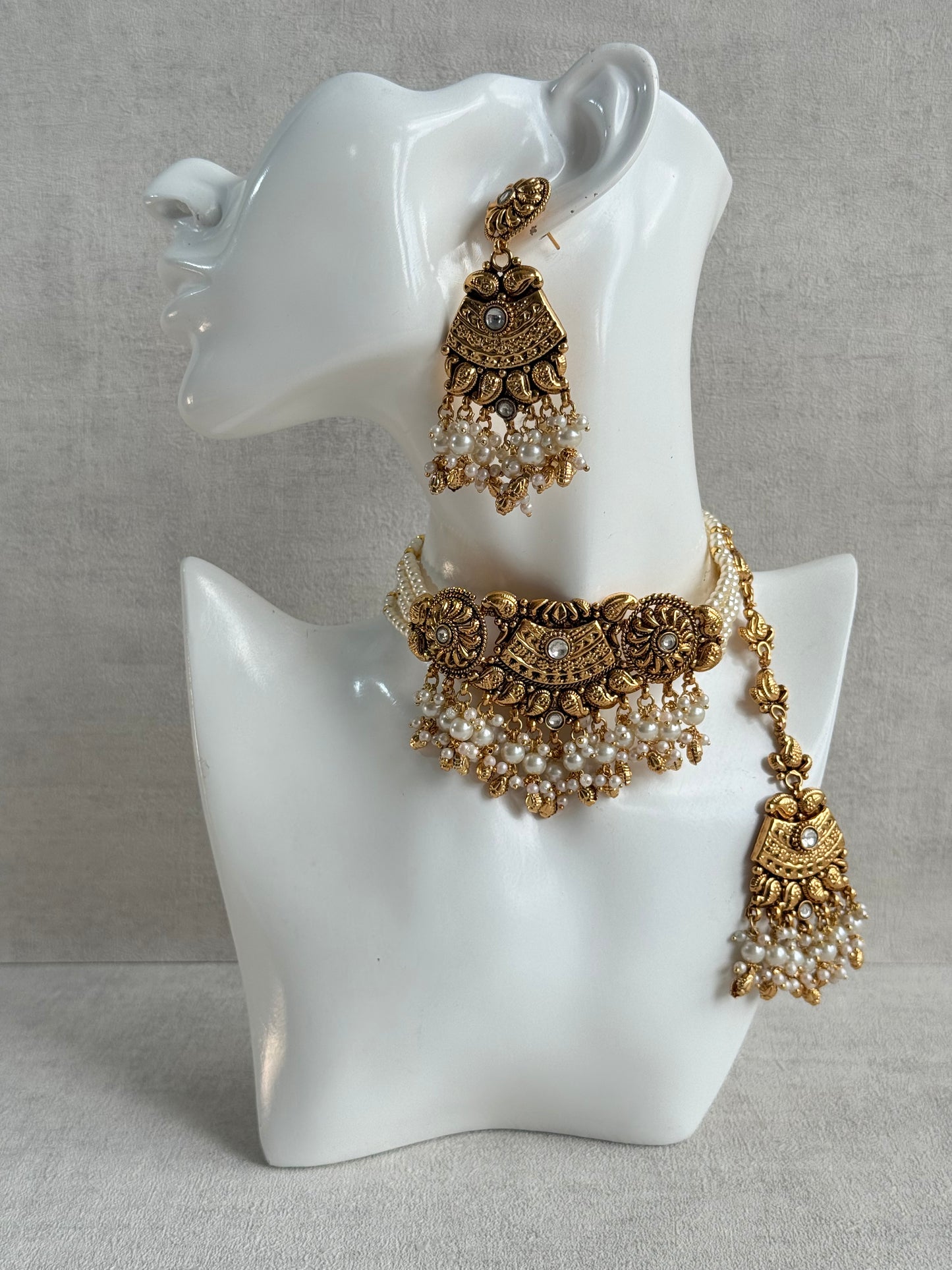 Ayura Designs Sairish Choker Set with Earrings & Tikka – Ivory Beads, Pearl Detailing, Ghungroos, Paisley Motifs & Antique Gold Finish