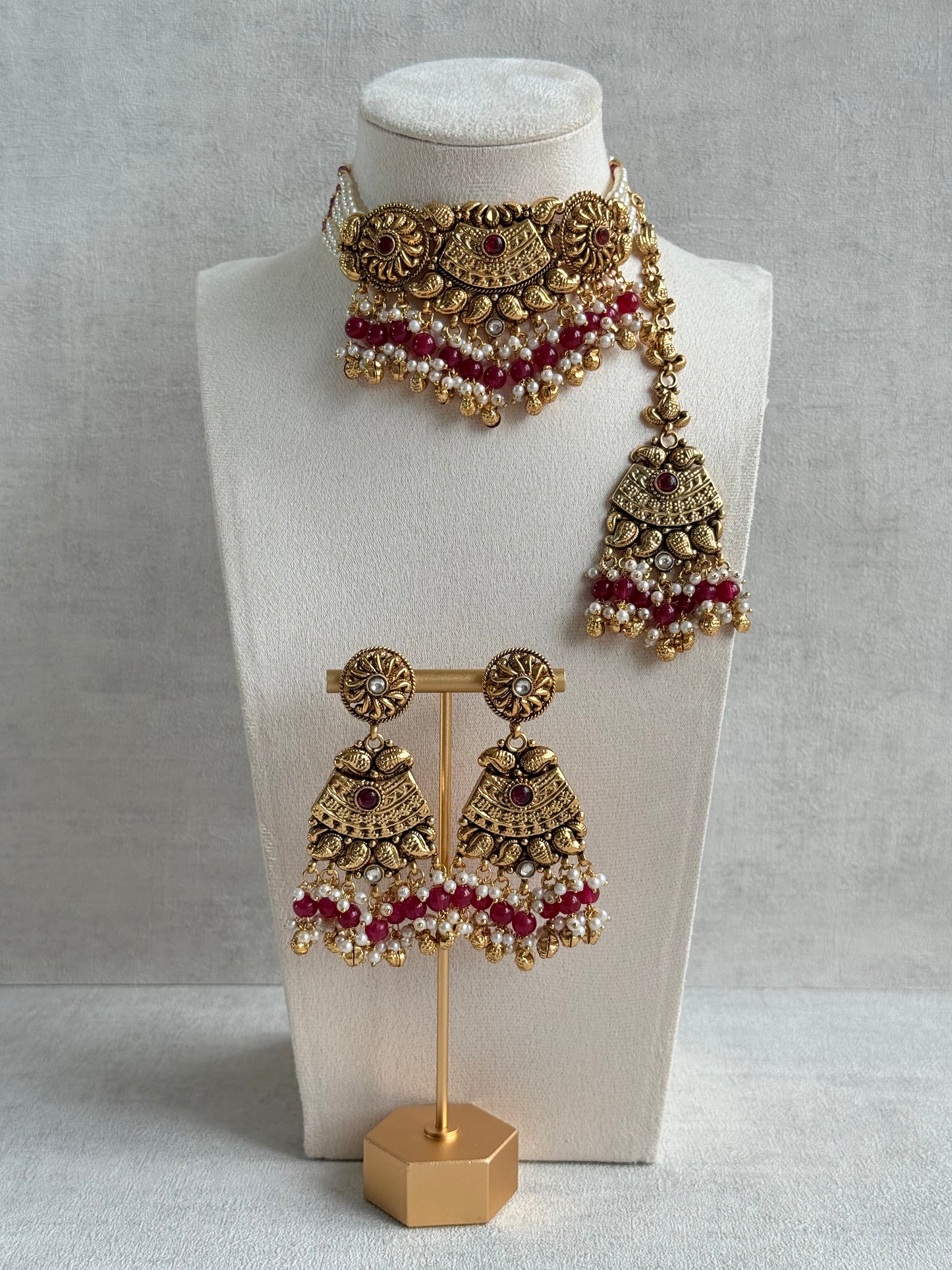 Ayura Designs Sairish Choker Set with Earrings & Tikka – Ruby Pink Beads, Pearl Detailing, Ghungroos, Paisley Motifs & Antique Gold Finish
