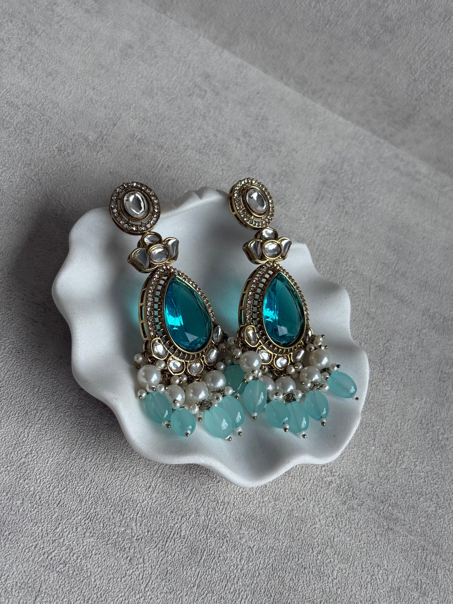 Ayura Designs Nageen Earrings – Antique Gold Jhumkis with Aqua Blue Stones, Mirror-Cut Accents & Pearl Drops
