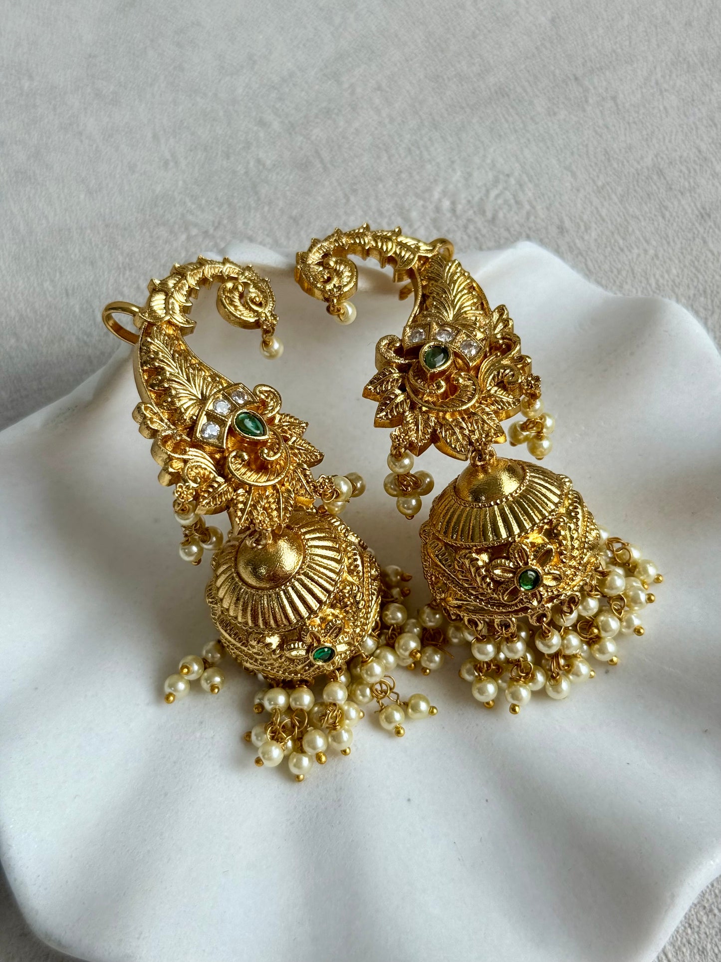 Ayura Designs Anika Jhumkis – Gold Half Ear Cuffs with Peacock Motif, Green Stone Accents, Kundan Crystals & Pearl Jhumka Drops