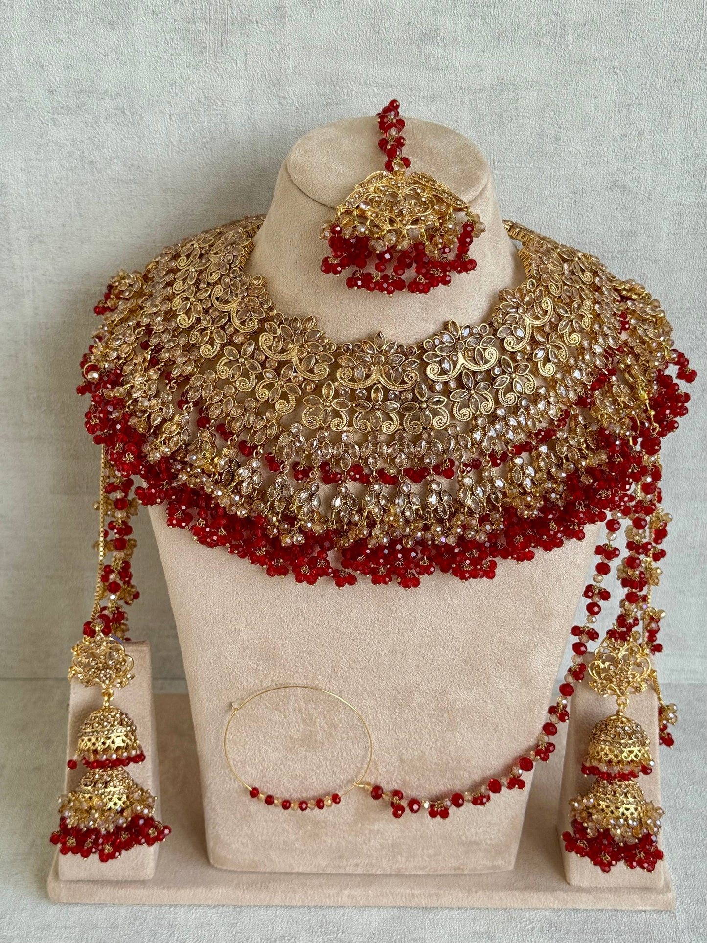 Ayura Designs Ishqiya Bridal Set with Necklace, Jhumkis with Sahare, Tikka & Jhoomer – Antique Gold, Champagne Stones & Red Bead Detailing