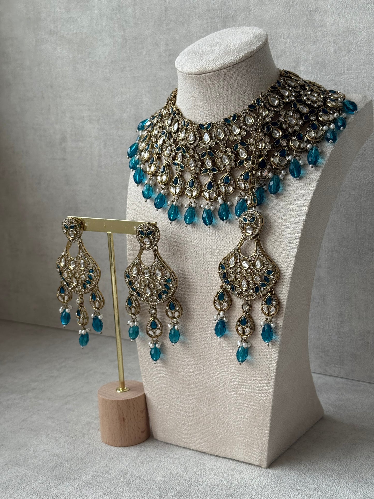 Ayura Designs Hoorain Set with Earrings – Antique Gold Finish, Mirror-Cut Stones & Peacock Blue Beads