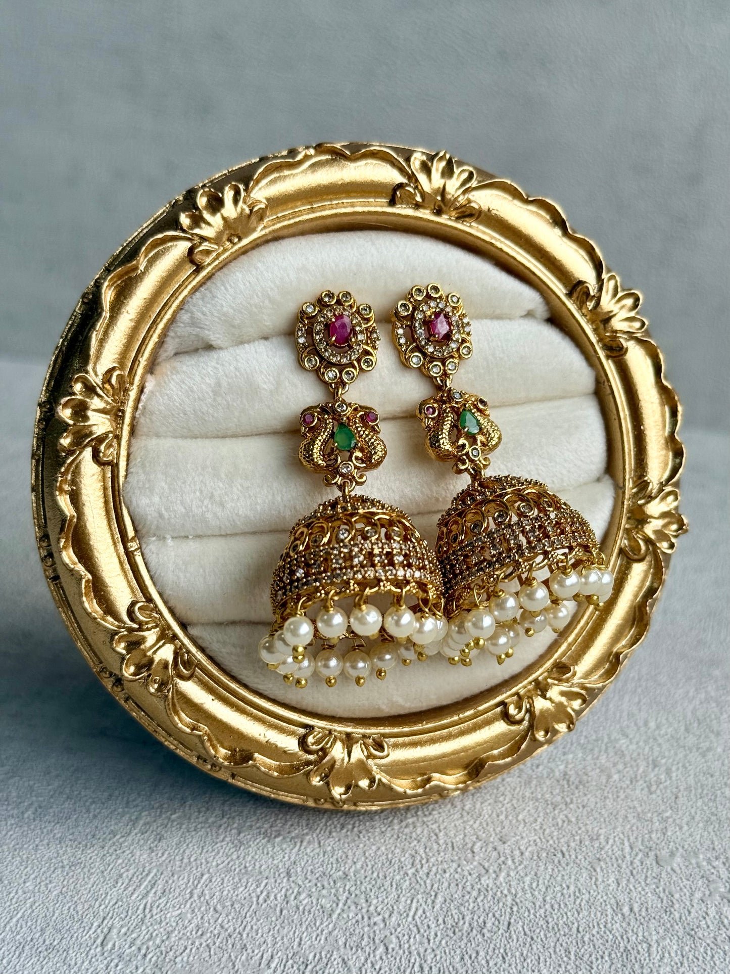 Ayura Designs Darya Jhumkis – Gold Peacock Motif Jhumkis with Ruby Pink, Emerald Green and Pearl Detailing