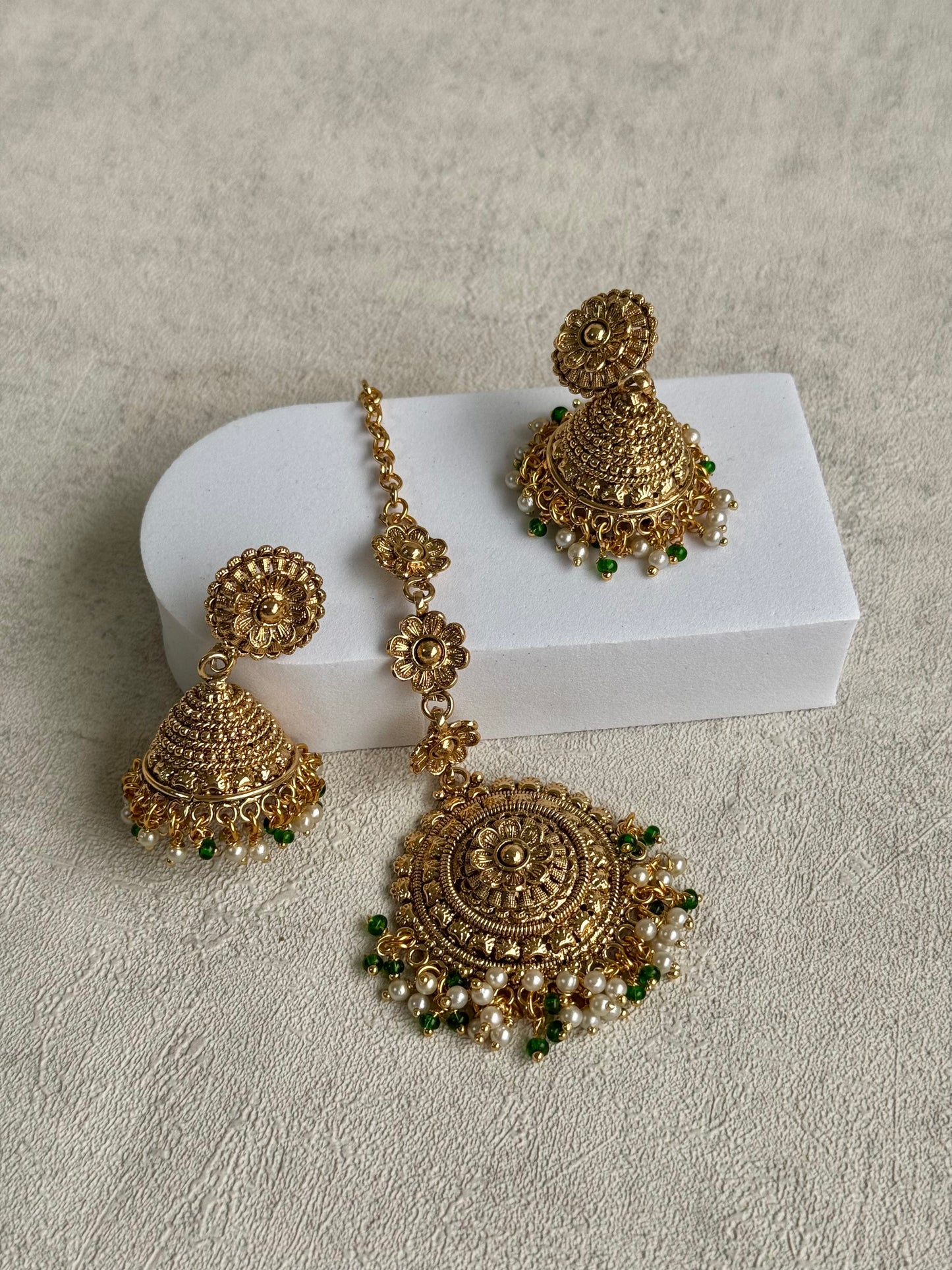 Ayura Designs Nooriya Choker Set with Jhumkis & Tikka: Exquisite Gold-Tone Ensemble Adorned with White & Green Beads