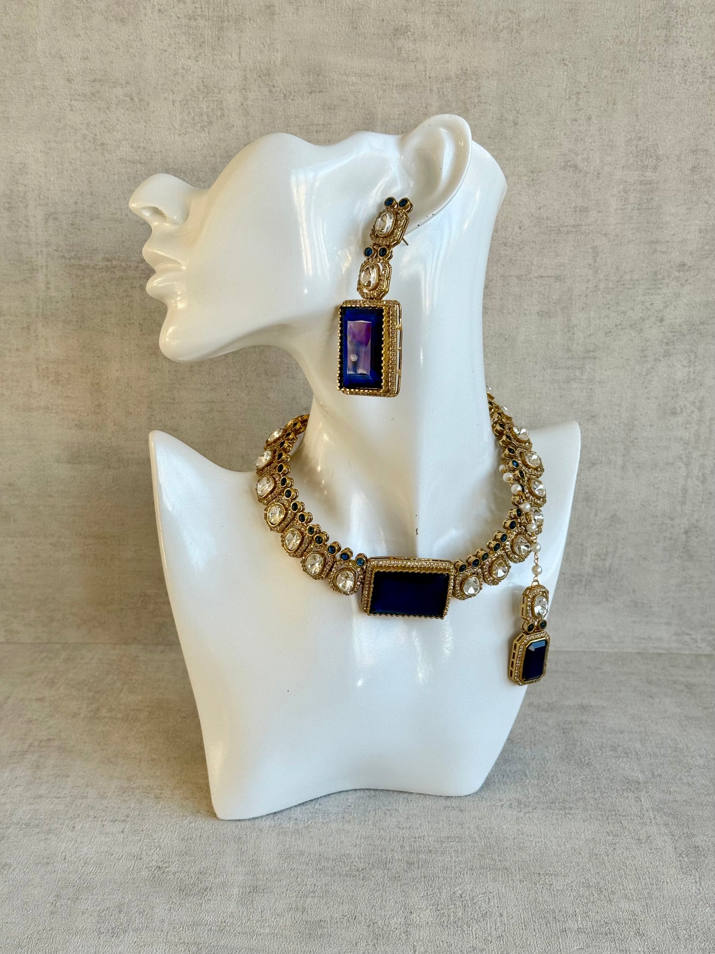 Ayura Designs Clara Set with Earrings & Tikka  – Royal Blue Stones with Moissanite and Antique Gold Finish