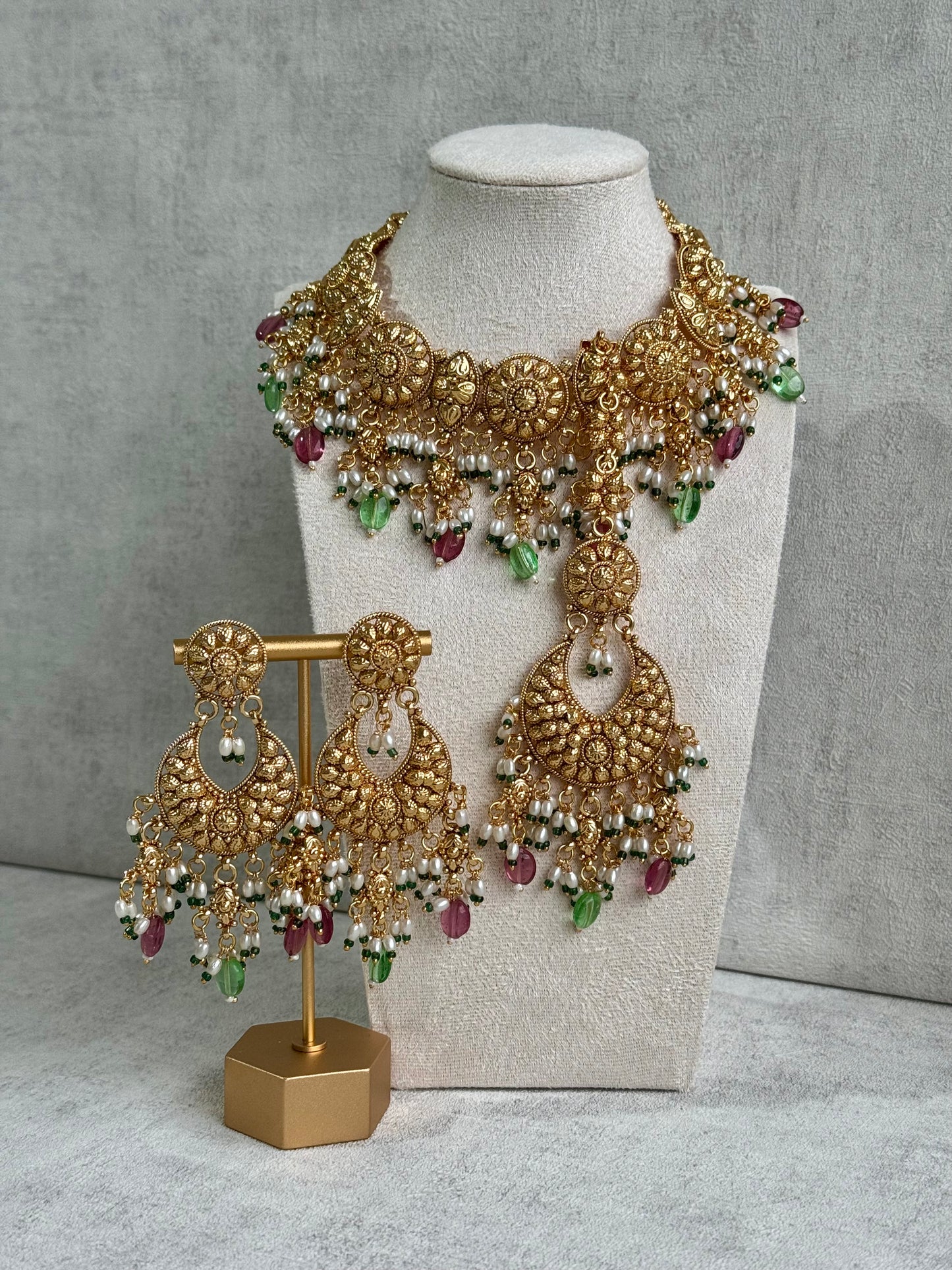 Ayura Designs Rummy Set – Opulent Gold Adornment with Radiant Pink, Green & White Beads | Includes Earrings & Tikka