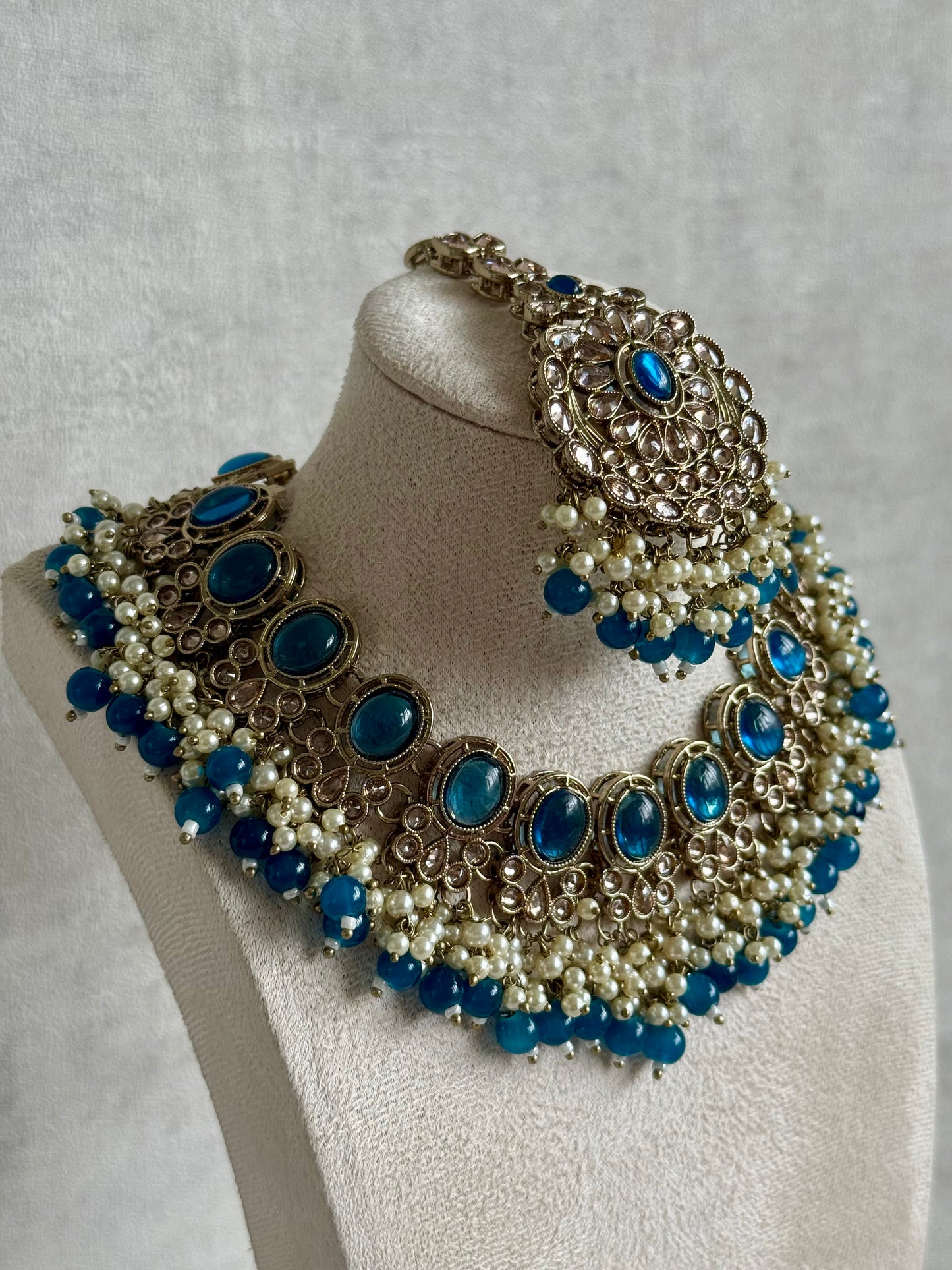 Ayura Designs Zubi Set with Jhumkis & Tikka – Deep Blue Stones, Pearl Detailing & Antique Gold Finish