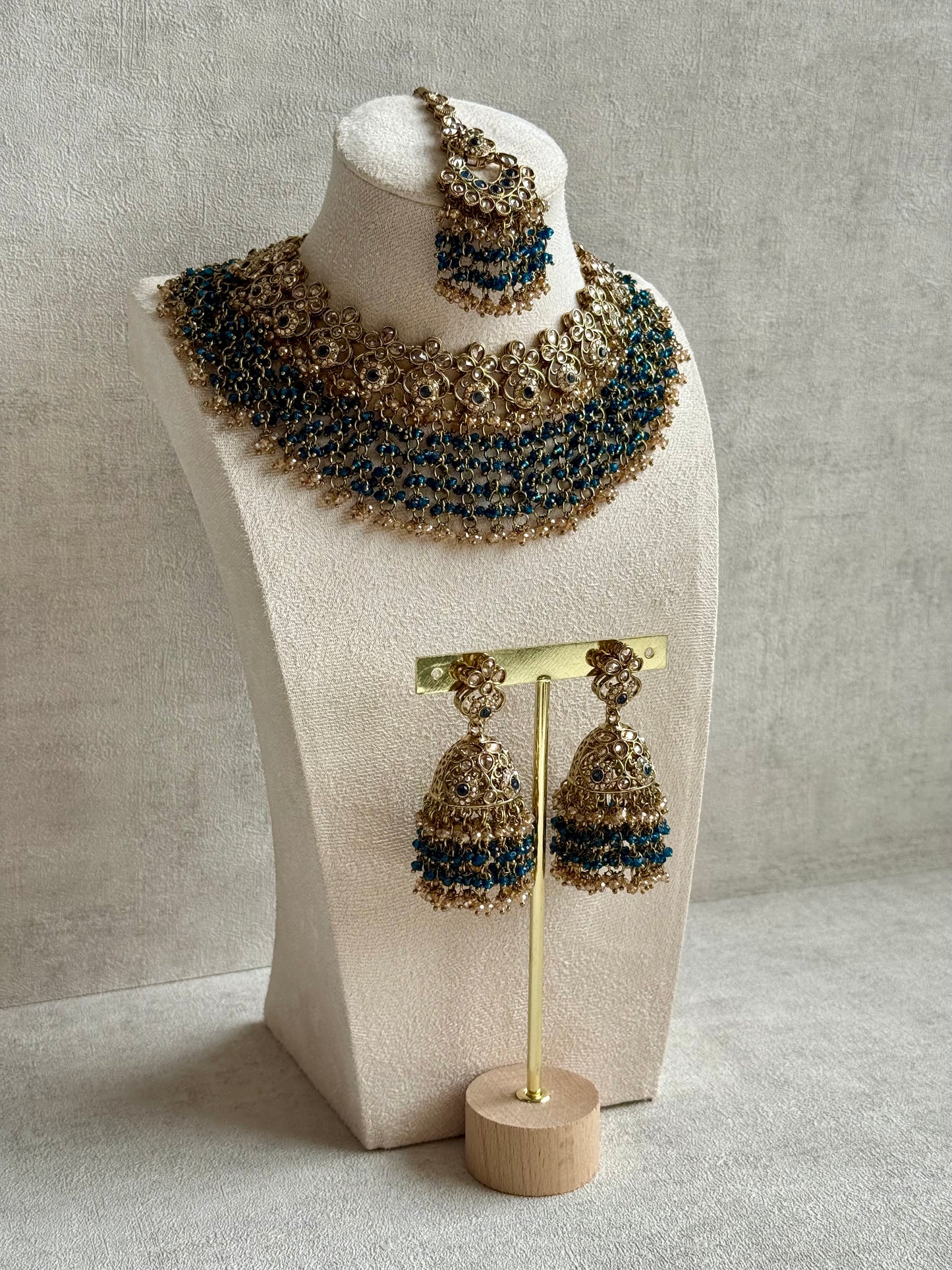 Ayura Designs Mahreen Set – Necklace, Jhumkis & Tikka with Mirror-Cut Stones, Peacock Blue Beads & Gold Finish