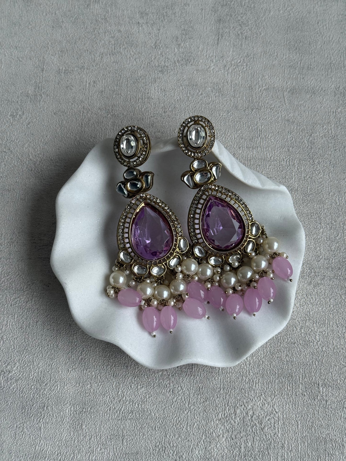 Ayura Designs Nageen Earrings – Antique Gold Jhumkis with Lilac Stones, Mirror-Cut Accents & Pearl Drops
