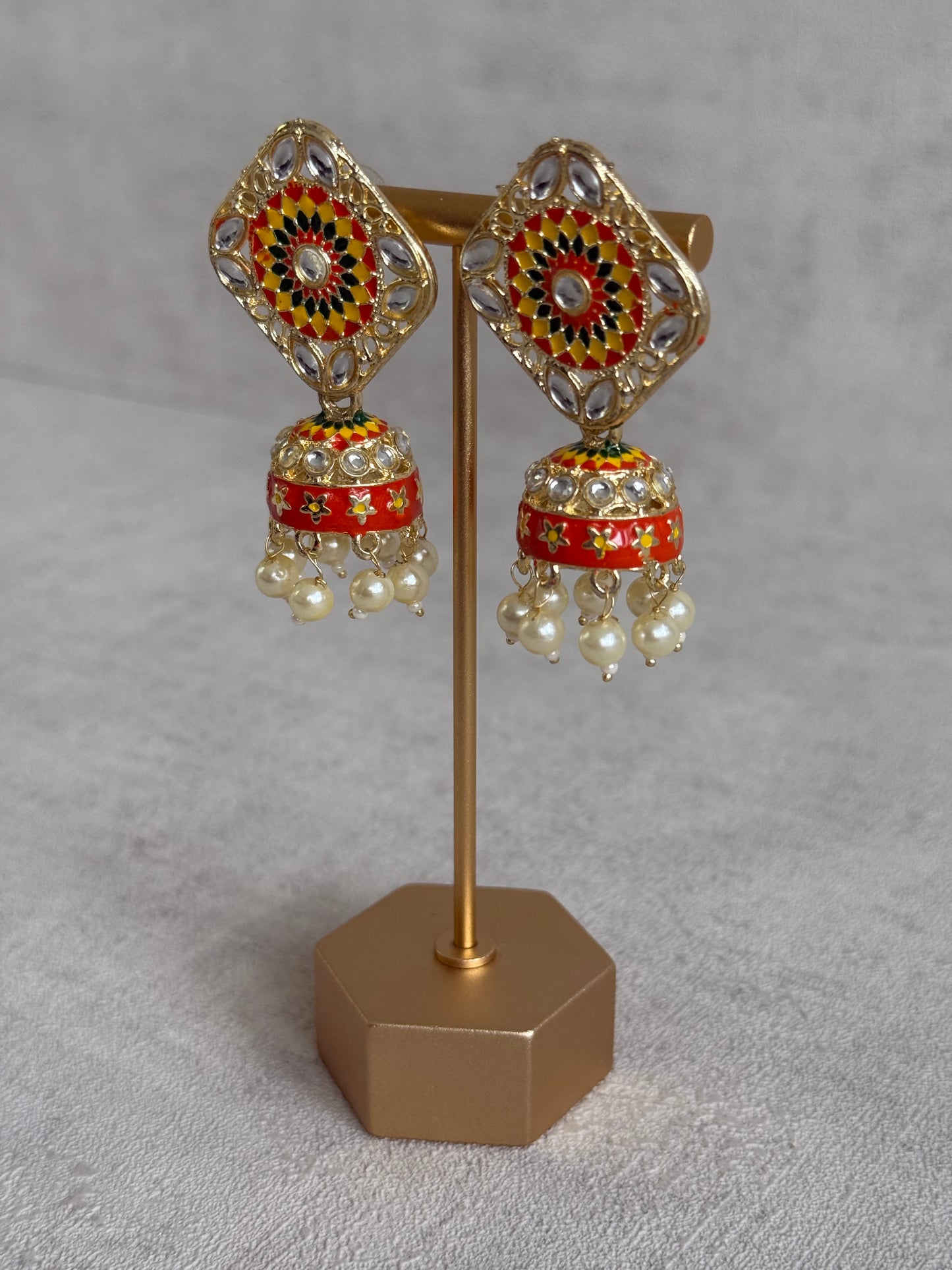 Ayura Designs Rangoli Jhumkis – Marigold Yellow, Ruby Red & Green Meenakari with Pearl Drops in Antique Gold Finish