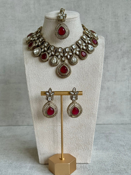 Ayura Designs Soha Set with Necklace, Earrings & Tikka – Mirror-Cut Clear & Ruby Red Stones in Antique Gold Finish