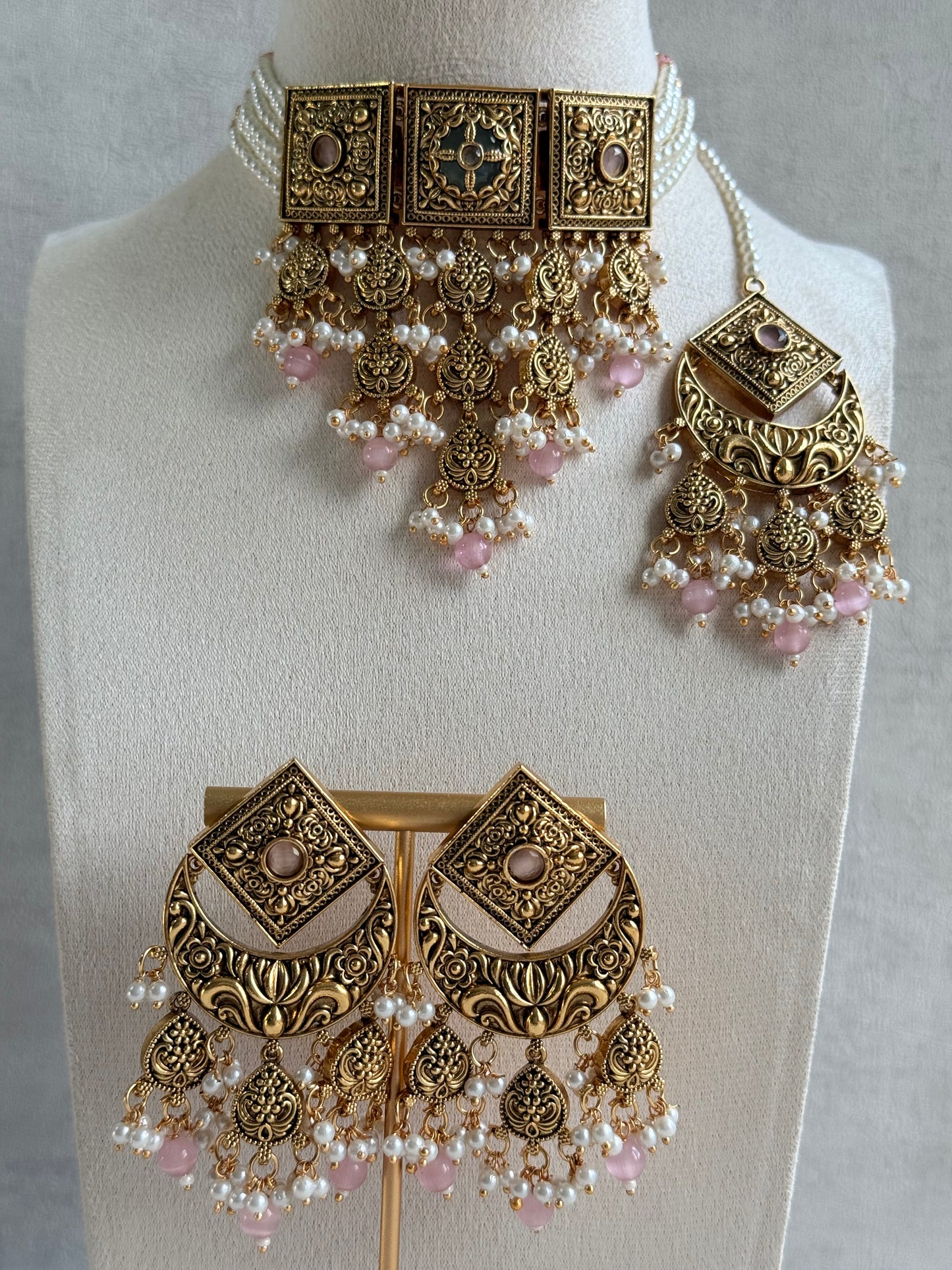 Ayura Designs Samera Choker Set with Earrings & Tikka – Blush Pink Beads, Pearl Detailing, Green Centre Stone, Floral Motifs & Antique Gold Finish