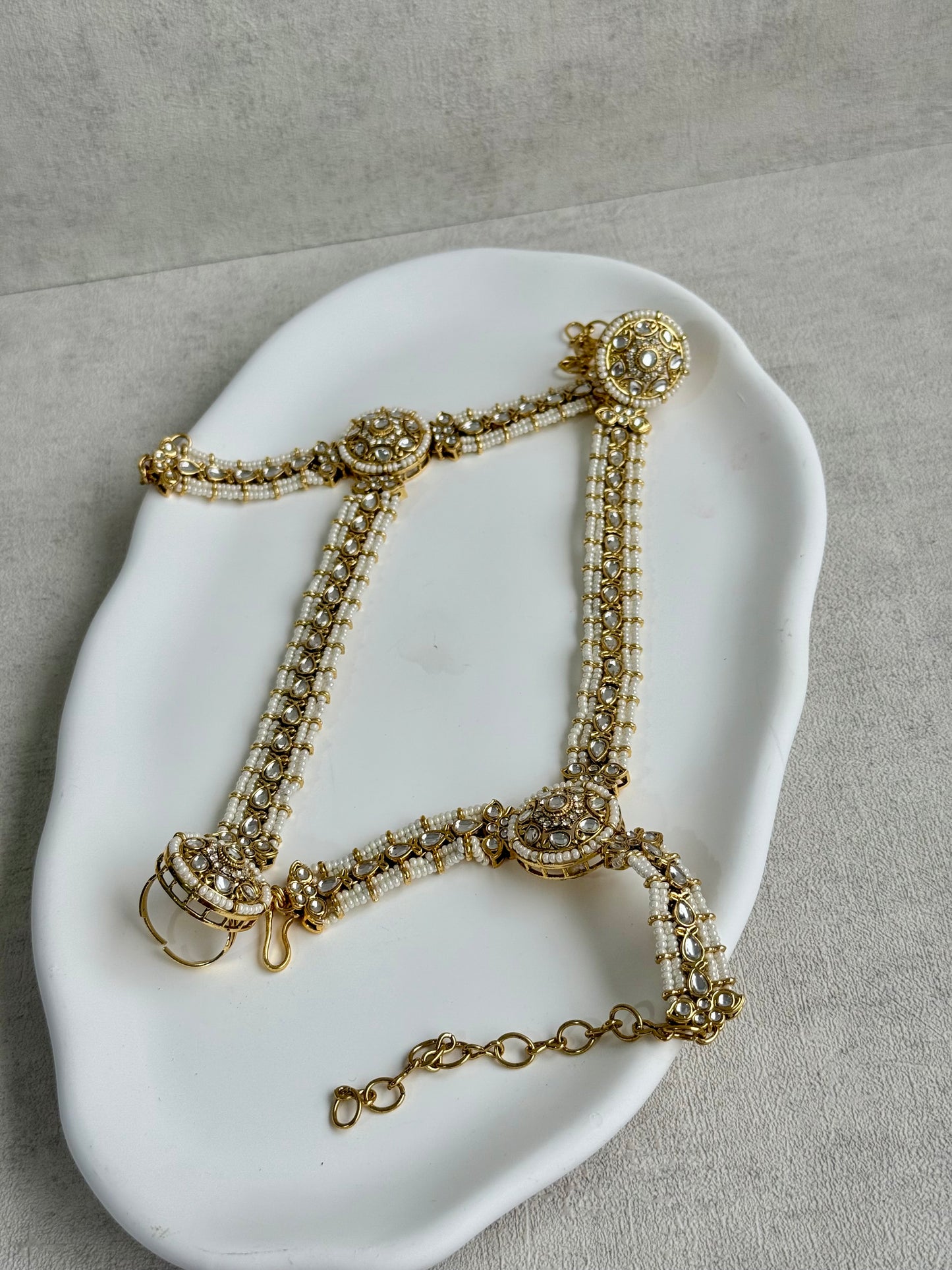 Ayura Designs Mirana Haathphool – Kundan Hand Harness with Pearl Detailing in Antique Gold Finish