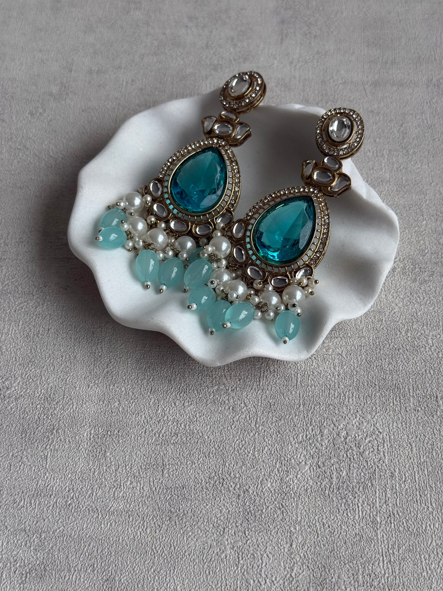 Ayura Designs Nageen Earrings – Antique Gold Jhumkis with Aqua Blue Stones, Mirror-Cut Accents & Pearl Drops