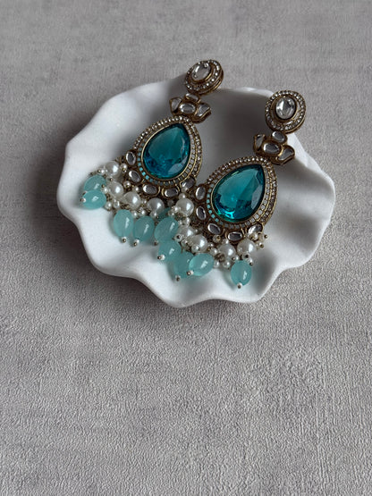 Ayura Designs Nageen Earrings – Antique Gold Jhumkis with Aqua Blue Stones, Mirror-Cut Accents & Pearl Drops