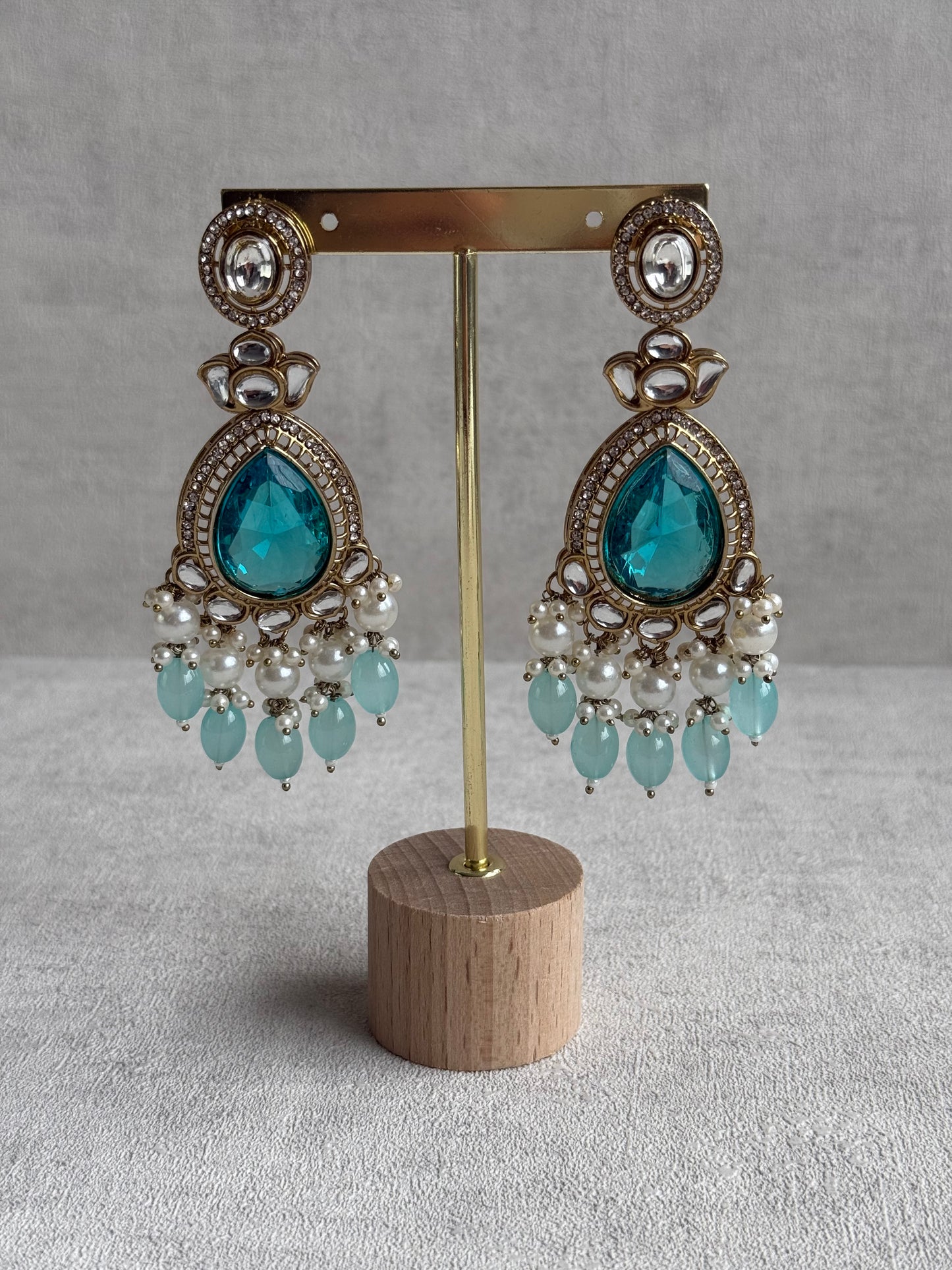 Ayura Designs Nageen Earrings – Antique Gold Jhumkis with Aqua Blue Stones, Mirror-Cut Accents & Pearl Drops