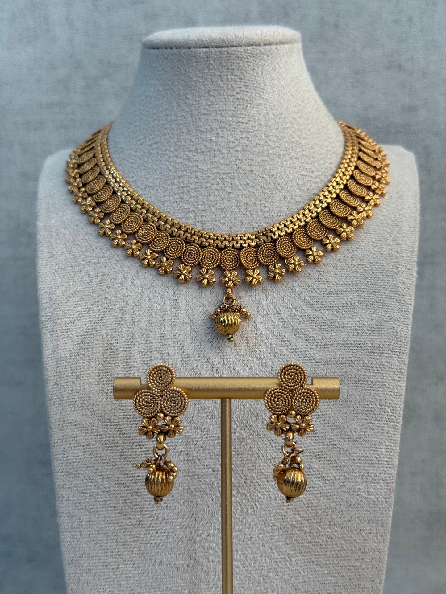 Ayura Designs Purna Set with Necklace & Earrings – Antique Gold Finish, Floral Motifs & Textured Pendant Detail