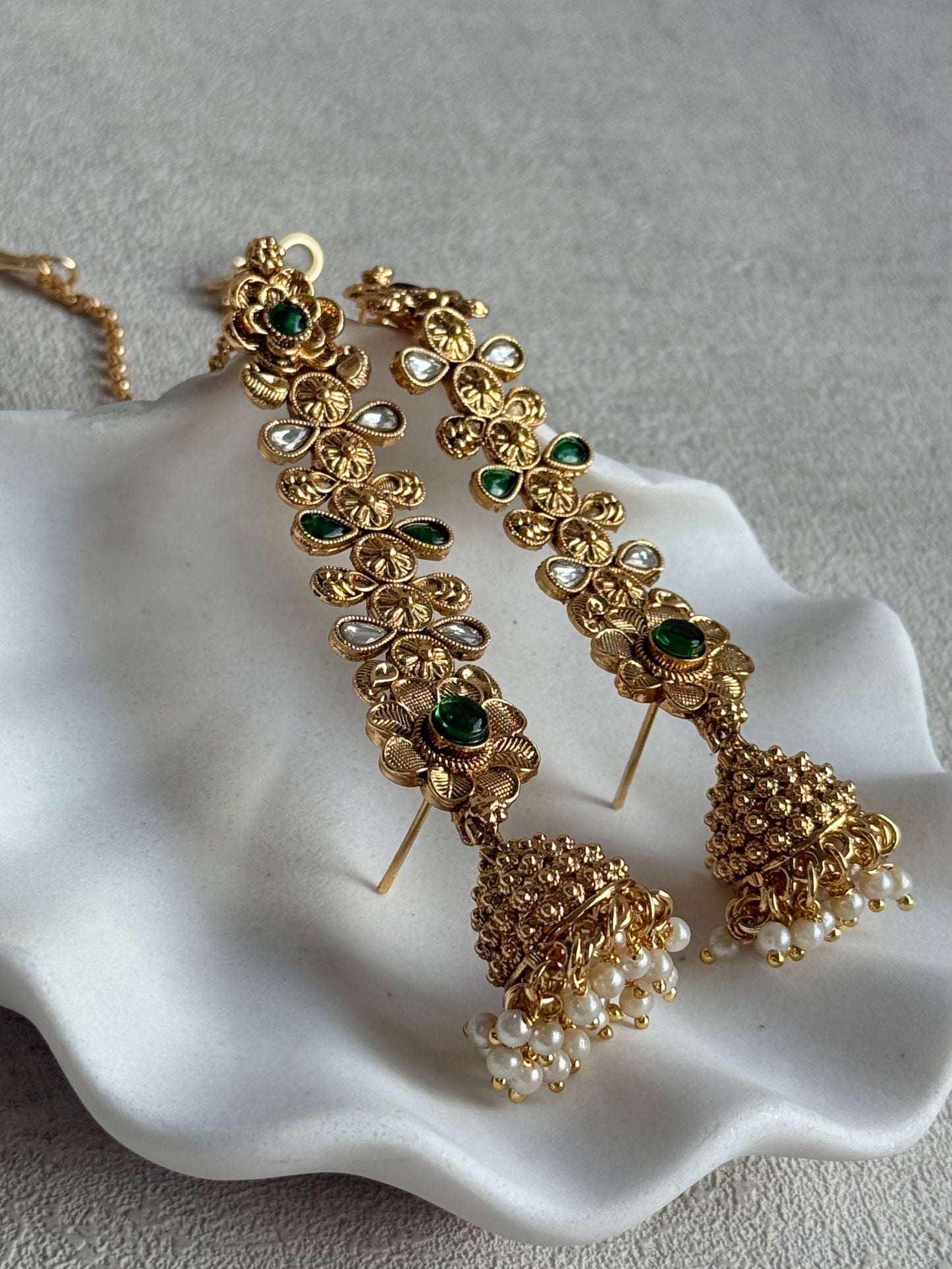 Ayura Designs Keerti Jhumkis – Antique Gold Kannauti Earrings with Emerald Green Stones, Mirror-Cut Detailing & Pearl Drops
